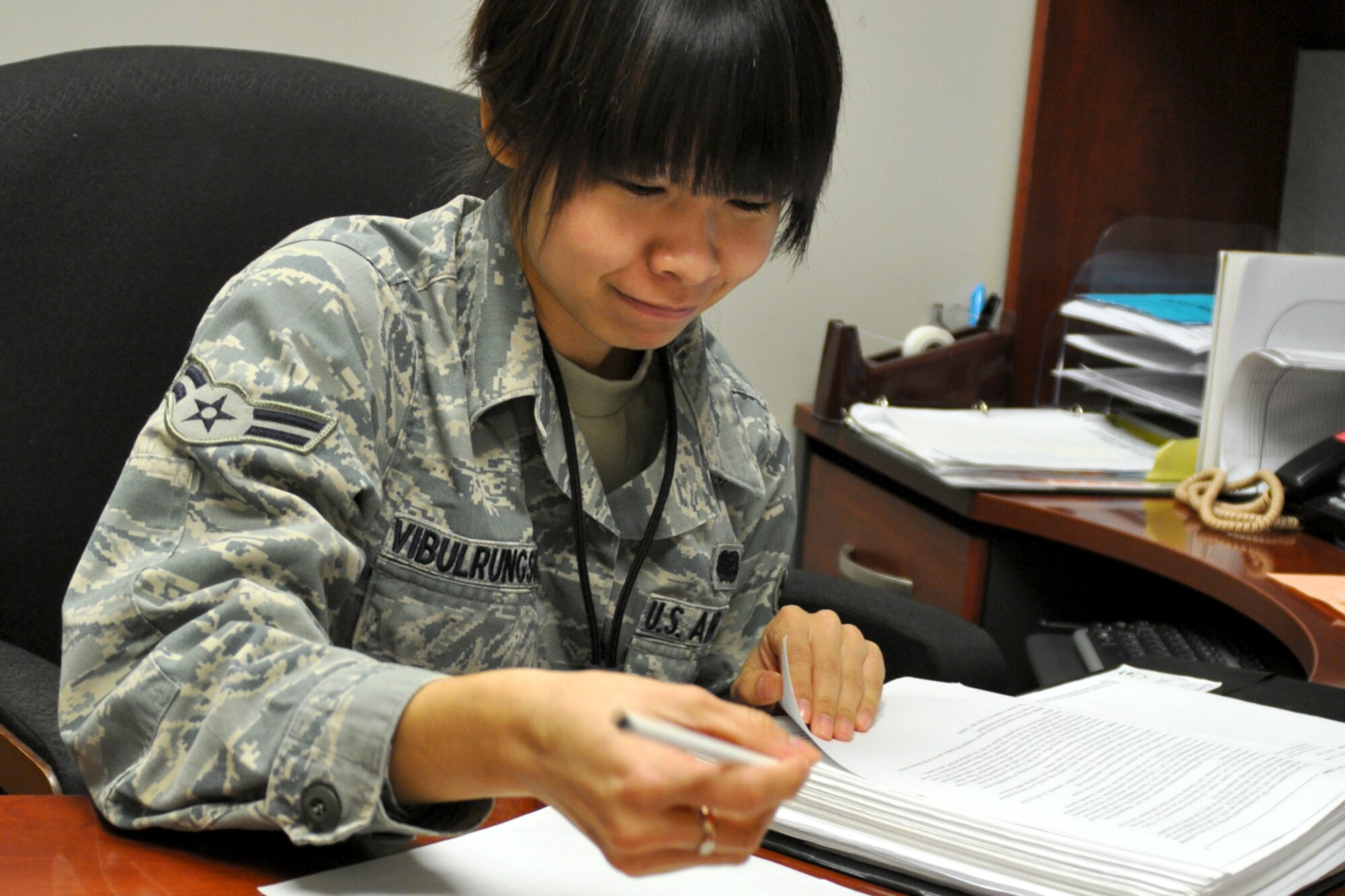 Airman 1st Class Nawarat Vibulrungsun, an information management helper for the 917th Wing Mission Support Group on Barksdale Air Force Base, La., reads through training materials during her Unit Training Assembly (UTA) weekend. Airman Vibulrungsun’s training covers many different areas. From something as simple as an inventory of materials to building a computer from the ground up, she must familiarize herself with it all. (U.S. Air Force Photo/ Senior Airman Crystal Marie Jordan)