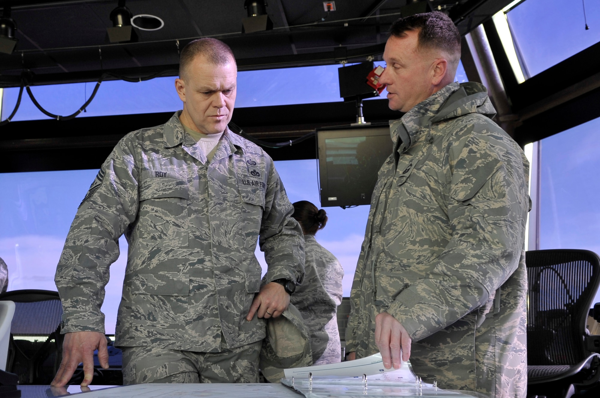 CANNON AIR FORCE BASE, N.M. -- Senior Master Sgt. Jeffrey Davis, 27th Special Operations Wing, briefs Chief Master Sergeant of the Air Force James Roy is briefed by about the future build up of Cannon AFB Jan. 19, 2009. Sergeant Davis described the number of building projects planned and how they will affect the quality of life for Cannon's Airmen. (U.S. Air Force photo by Staff Sgt. Heather R. Redman)