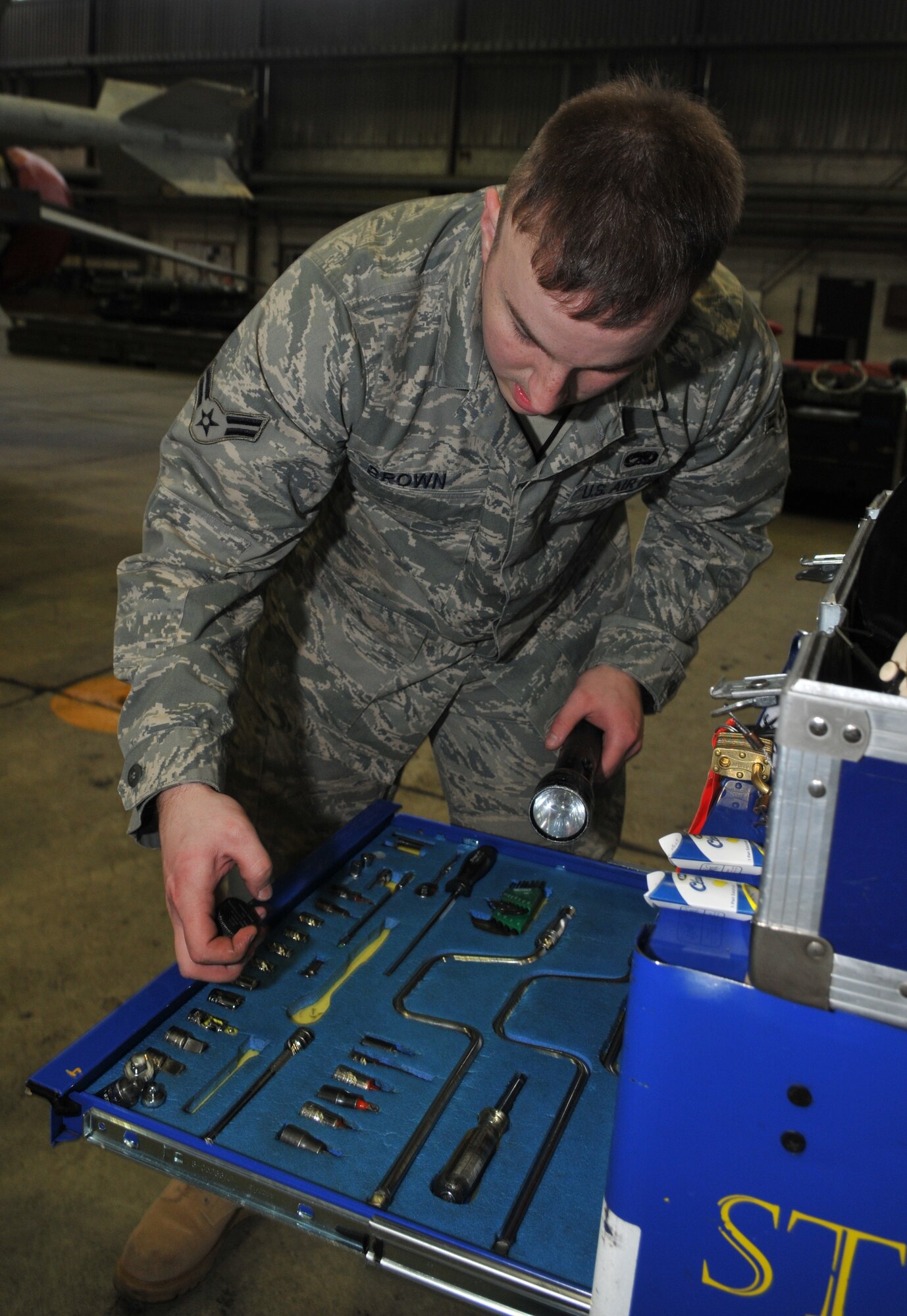 SPANGDAHLEM AIR BASE, Germany -- Airman 1st Class Travis Brown, 52nd Aircraft Maintenance Squadron, inspects the composite tool kit during the 52nd Fighter Wing Weapons Load Crew of the Year Competition Jan. 15. It's vital to ensure all tools are encountered for at the end of the load. . The 52 FW LCOY competition placed load crews from 2009's Weapons Load Crew of the Quarter competitions against each other to crown the weapons load crew of the year and consisted of a dress and appearance and composite tool-box inspection. The competition is still in action, and the winner has not yet been announced as the second quarter weapons load crew winning team is deployed. The contenders in the competition are from the 22nd, 23rd and 81st Aircraft Maintenance Units, and the winner will be announced Feb. 27 at the 52nd Maintenance Group Annual Awards Banquet. (U.S. Air Force photo/Airman 1st Class Nick Wilson)