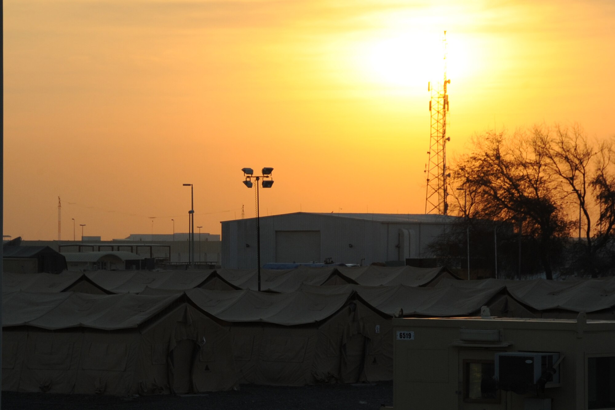 The suns sets over the 380th Air Expeditionary Wing at an undisclosed location in Southwest Asia on Jan. 20, 210. the 380th Air Expeditionary Wing, supports Operations Iraqi Freedom and Enduring Freedom and the Combined Joint Task Force-Horn of Africa. The 380th AEW is comprised of four groups and 12 squadrons and the wing's deployed mission includes air refueling, surveillance and reconnaissance in support of overseas contingency operations in Southwest Asia. (U.S. Air Force photo/Senior Airman Jenifer H. Calhoun/Released)
