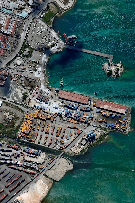 An aerial view of Port-au-Prince harbor in Haiti from an OC-135B Observation Aircraft Jan. 14. The OC-135B flew over Haiti for over three hours taking panoramic photos to help coordinate U.S. military support to the Haiti relief effort. (U.S. Air Force photo by Airman 1st Class Perry Aston) 