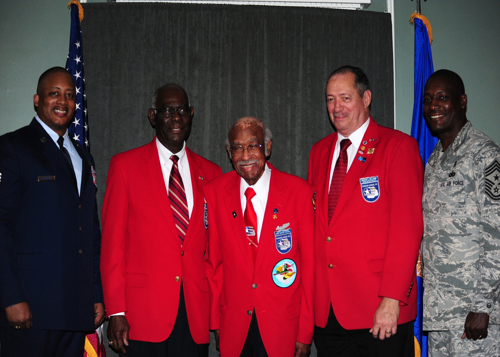 SHAW AIR FORCE BASE, S.C. -- Chief Master Sgt. Fred Drummond (far left), 20th Security Forces squadron security forces manager, and Chief Master Sgt. Lefford Fate (far right), 20th Fighter Wing command chief, pose with Mr. Bill McClary (left center), Dr. Leroy Bowman (center), and Mr. Marvin Williams (right center), members of the Lt. Col. Spann Watson Chapter of Tuskegee Airmen Inc. Jan. 15. The chapter is located in Columbia, S.C. (U.S. Air Force photo/2nd Lt. Tony Richardson)