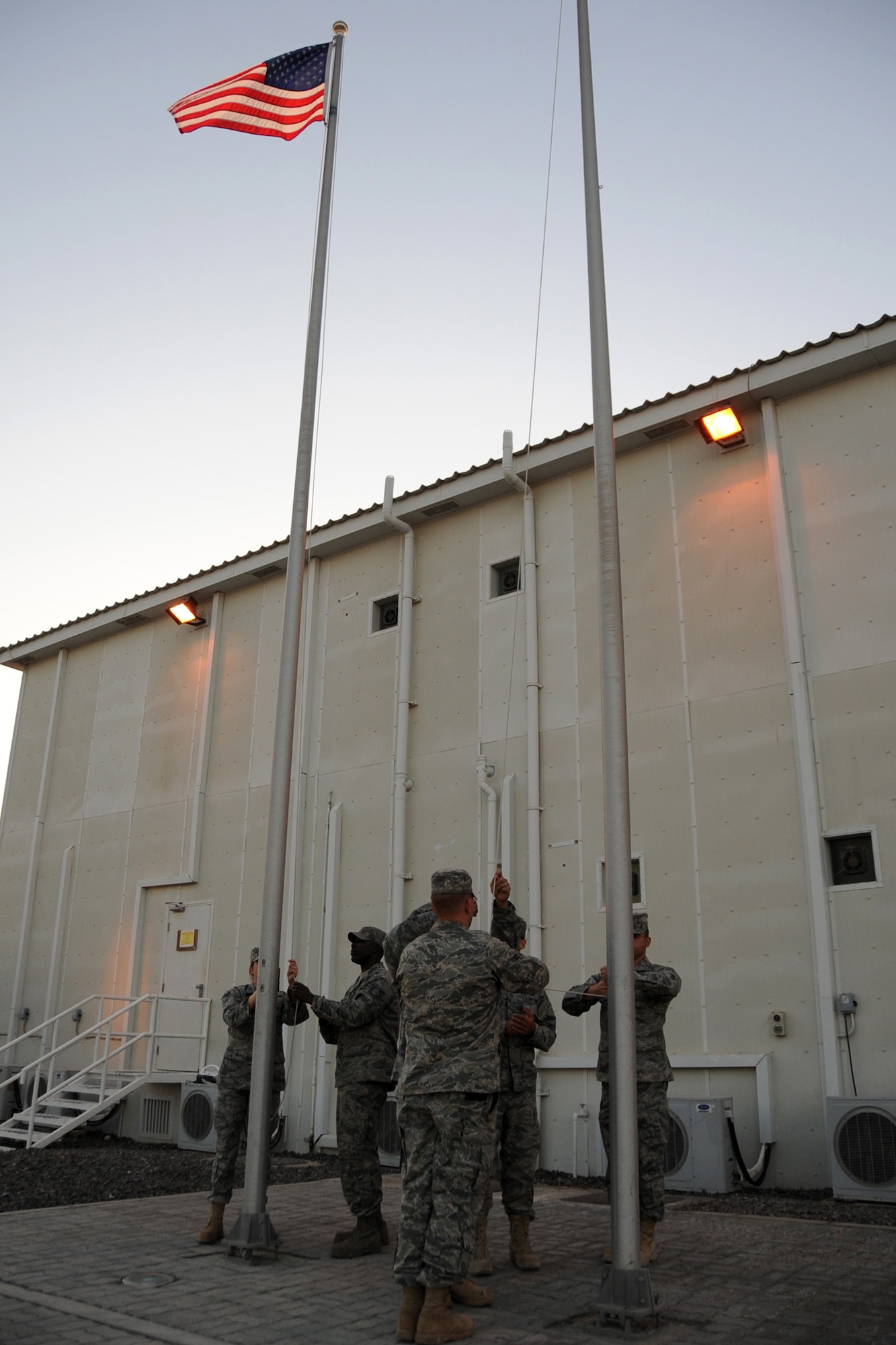 Members of the 380th Air Expeditionary Wing honor guard practice drill and ceremony procedures at an undisclosed location in Southwest Asia on Jan. 19, 2010.  The group is comprised of deployed Airmen that work, on average, 12 plus hours each day in their indivual work units and volunteer for the honor guard twice a week for several hours as well as performing drill and ceremony at official functions throughout the base. (U.S. Air Force photo/Senior Airman Jenifer H. Calhoun/Released)
