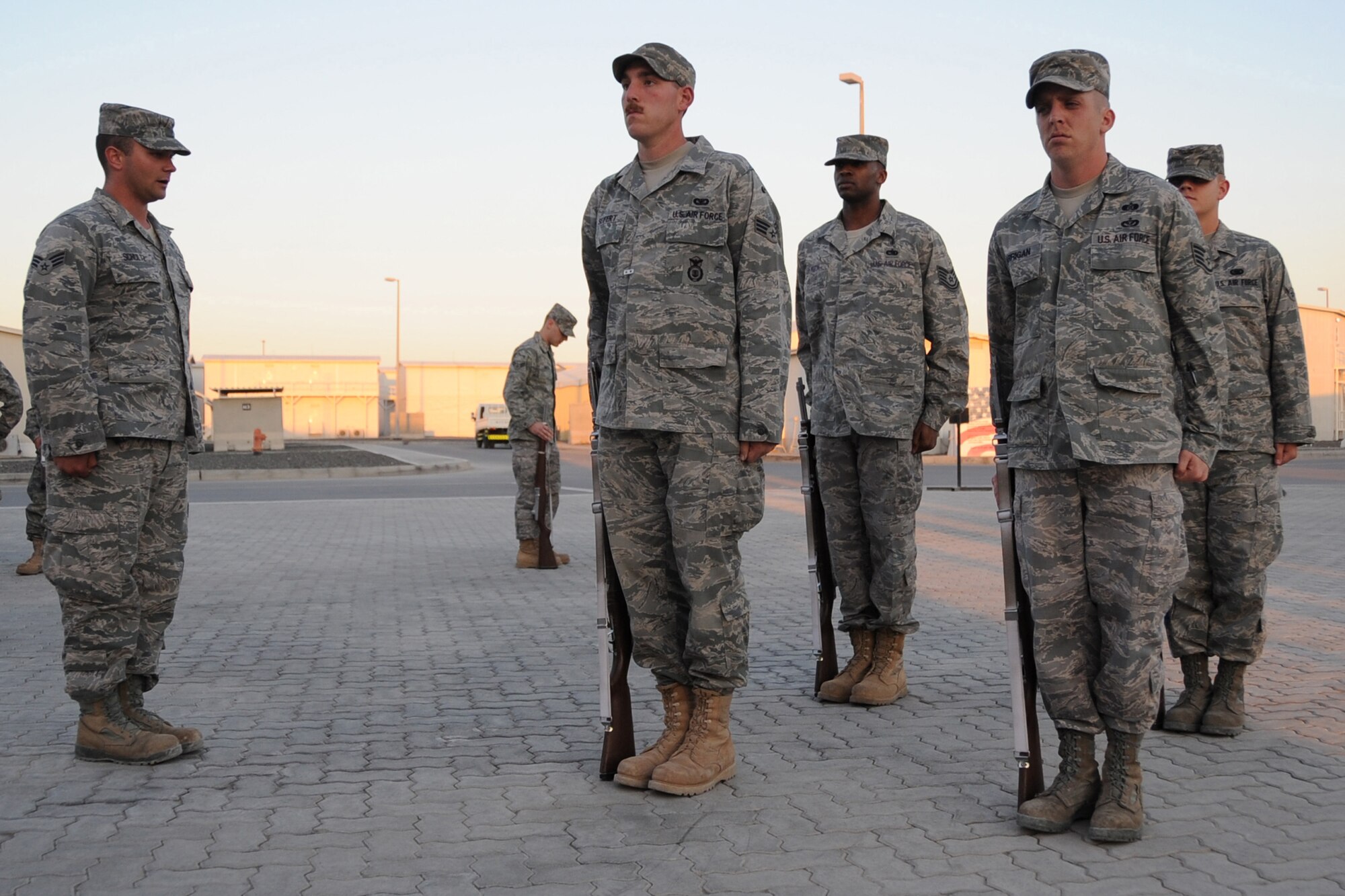 Members of the 380th Air Expeditionary Wing honor guard practice drill and ceremony procedures at an undisclosed location in Southwest Asia on Jan. 19, 2010.  The group is comprised of deployed Airmen that work, on average, 12 plus hours each day in their indivual work units and volunteer for the honor guard twice a week for several hours as well as performing drill and ceremony at official functions throughout the base. (U.S. Air Force photo/Senior Airman Jenifer H. Calhoun/Released)
