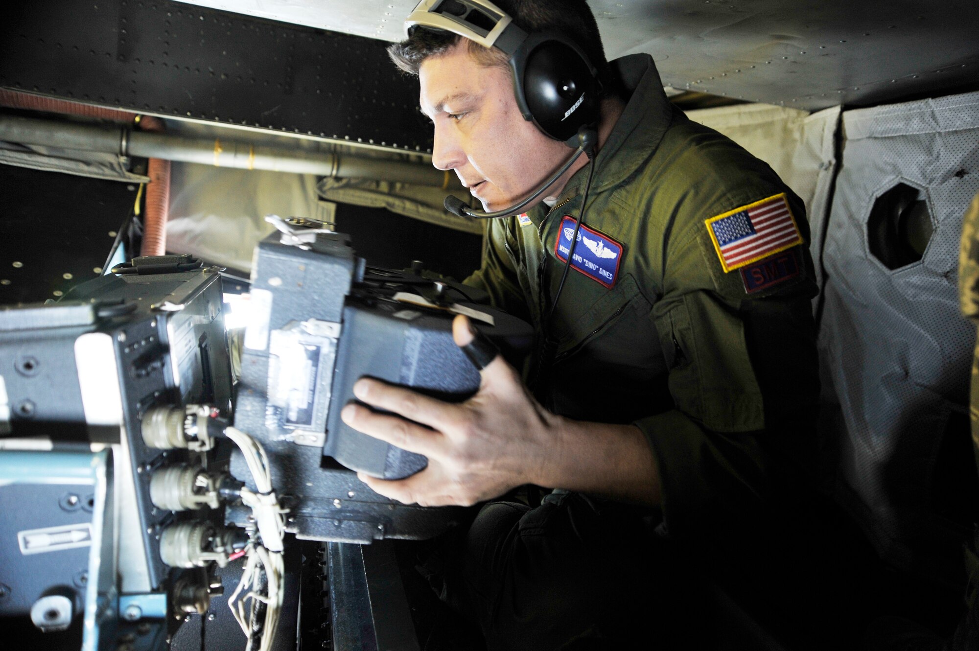 Master Sgt. David Dines changes out the film aboard an OC-135B Open Skies observation aircraft during pre-flight checks Jan 16, 2010, at Joint Base Andrews, Md. The OC-135B is used to conduct observation flights in support of the Open Skies Treaty. The OC-135B is with the 45th Reconnaissance Squadron at  Offutt Air Force Base, Neb. (U.S. Air Force photo/Airman 1st Class Perry Aston)