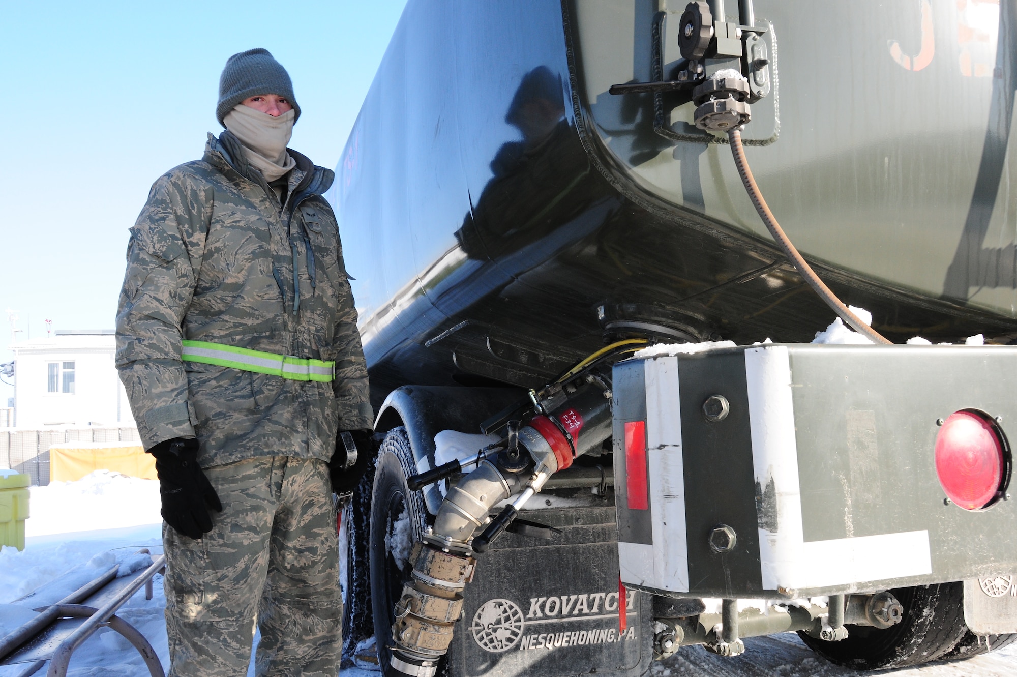 Airman 1st Class Justin Bell, pumps jet fuel into a tank to be transported to the flightline at the Transit Center at Manas, Kyrgyzstan, Jan. 19, 2010. Airman Bell is a 376th Expeditionary Logistics Readiness Squadron petroleum, oil and lubricants specialist. The POL flight here was the first in the AOR to implement a new pre-filter system for fuel which will save time and money and deliver better, cleaner fuel to the aircraft the KC-135 refuels. (U.S. Air Force photo/Senior Airman Nichelle Anderson/Released)