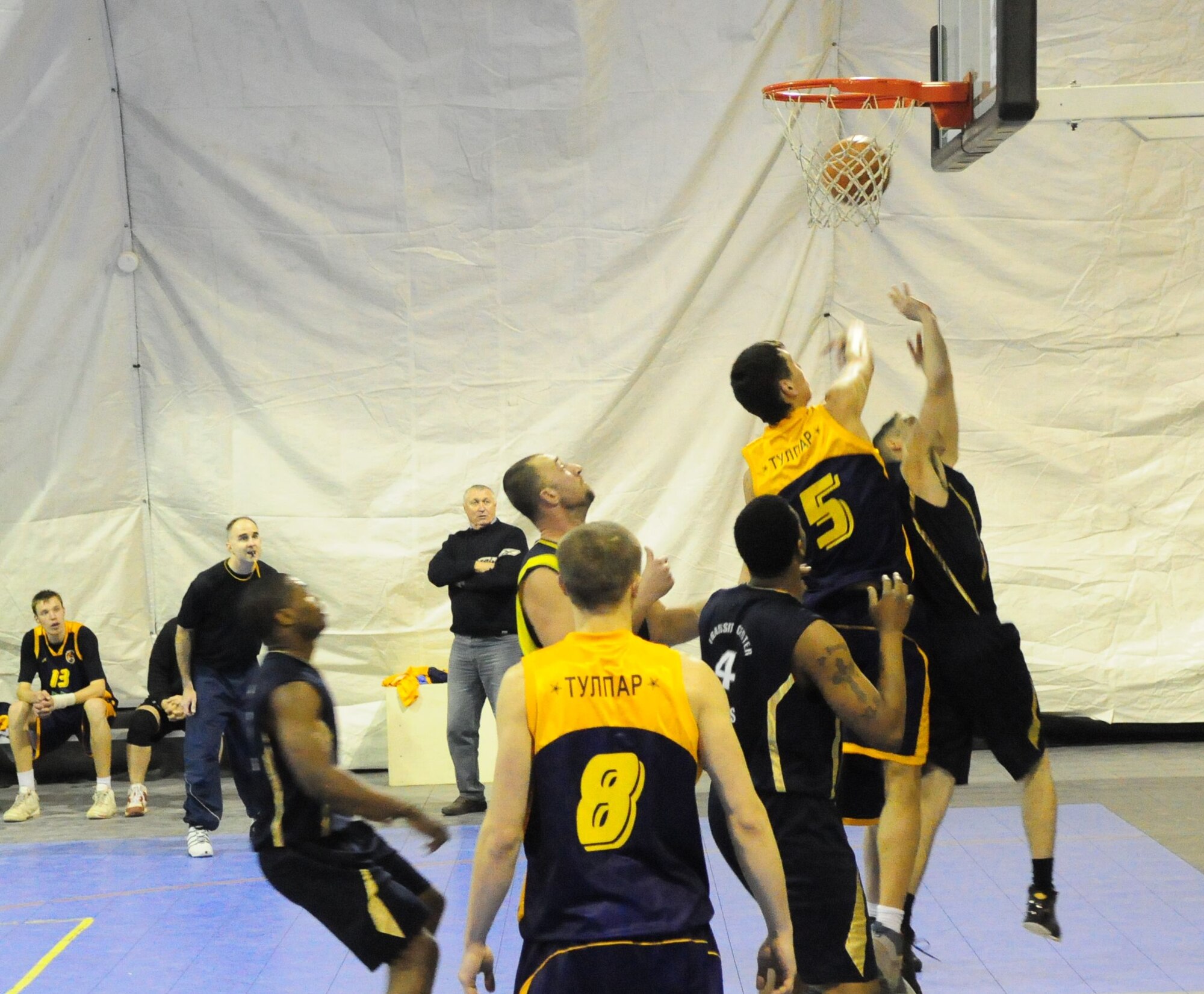 A U.S. Air Force member of the Transit Center at Manas basketball team gets off a shot during a good will game against the Academy of Physical Culture and Sports, Jan. 19, 2010. The APCS defeated the TC team 72-55.  (U.S. Air Force photo/Senior Master Sgt. Mike Litsey/released)