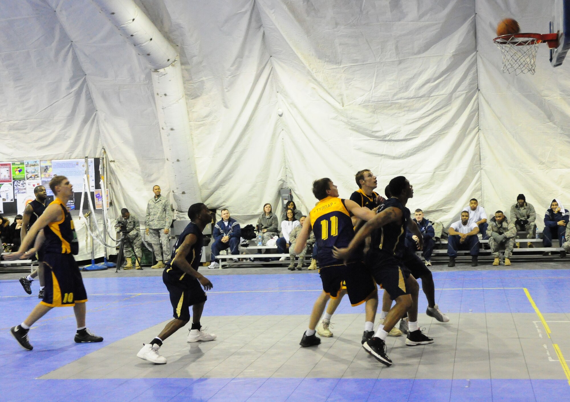 A student of the Academy of Physical Culture and Sports hits a free throw during a good will basketball game against U.S. Air Force members from the Transit Center at Manas, Kyrgyzstan, Jan. 19, 2010. The APCS defeated the TC team 72-55. (U.S. Air Force photo/Senior Master Sgt. Mike Litsey/released)