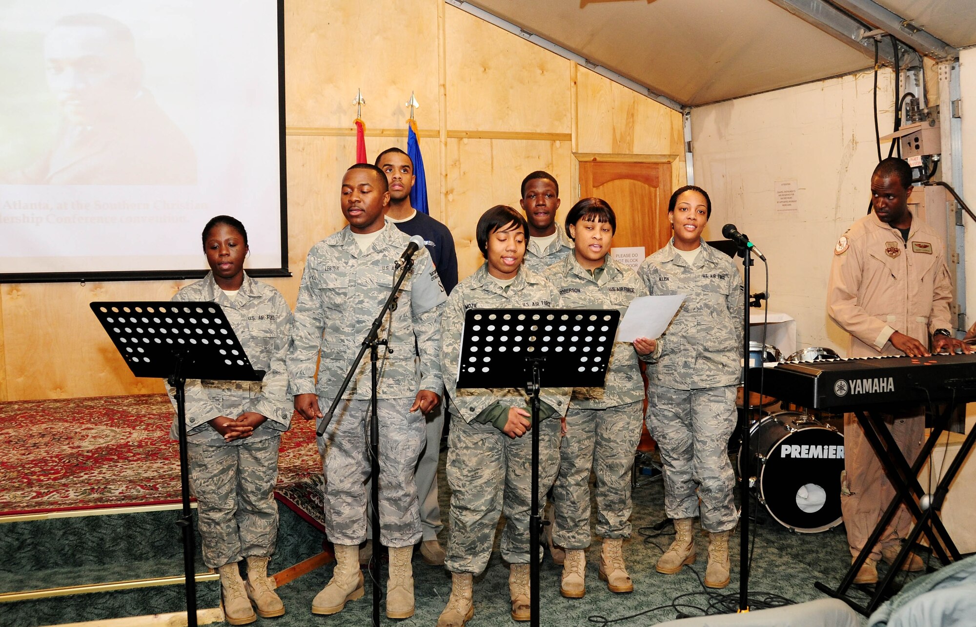 The 376th Air Expeditionary Wing Gospel choir performs "Lift Every Voice" during the Martin Luther King, Jr. Remembrance Ceremony at the Transit Center at Manas, Kyrgyzstan, Jan. 18, 2010. (U.S Air Force photo/Senior Airman Nichelle Anderson/released)
