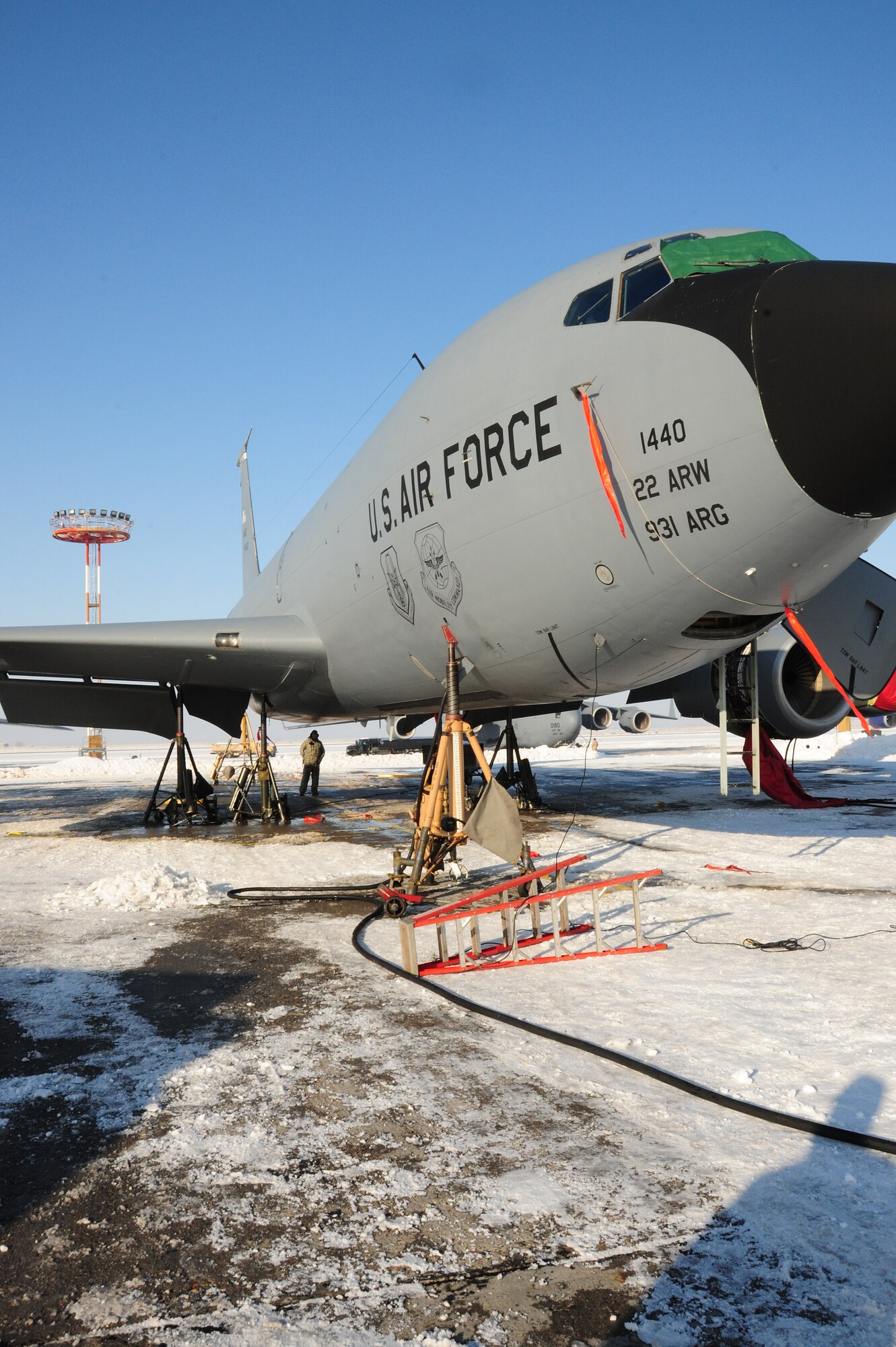 376th Expeditionary Aircraft Maintenance Squadron Airmen jack up a KC-135 Stratotanker on the flightline at the Transit Center at Manas, Kyrgyzstan, Jan. 20, 2010, to test the landing gear hydraulics. In temperatures of -8F and in spite of 10 inches of snow, Airmen here continue to ensure the wing mission gets done. The tankers here deliver hundreds of thousands of pounds of fuel to coalition combat aircraft over Afghanistan. (U.S. Air Force photo/Senior Airman Nichelle Anderson/Released)