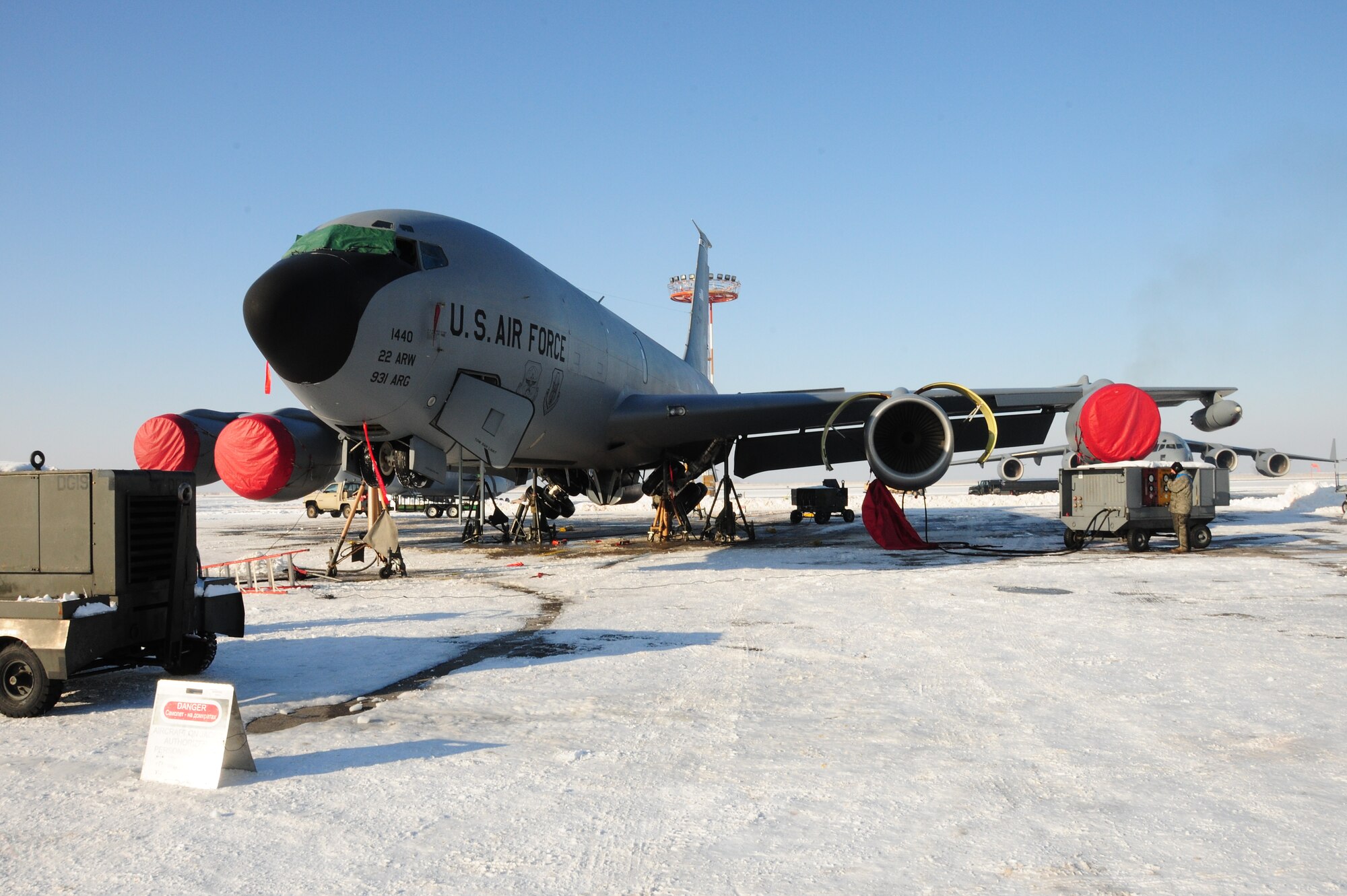 376th Expeditionary Aircraft Maintenance Squadron Airmen jack up a KC-135 Stratotanker on the flightline at the Transit Center at Manas, Kyrgyzstan, Jan. 20, 2010, to test the landing gear hydraulics. In temperatures of -8F and in spite of 10 inches of snow, Airmen here continue to ensure the wing mission gets done. The tankers here deliver hundreds of thousands of pounds of fuel to coalition combat aircraft over Afghanistan. (U.S. Air Force photo/Senior Airman Nichelle Anderson/Released)