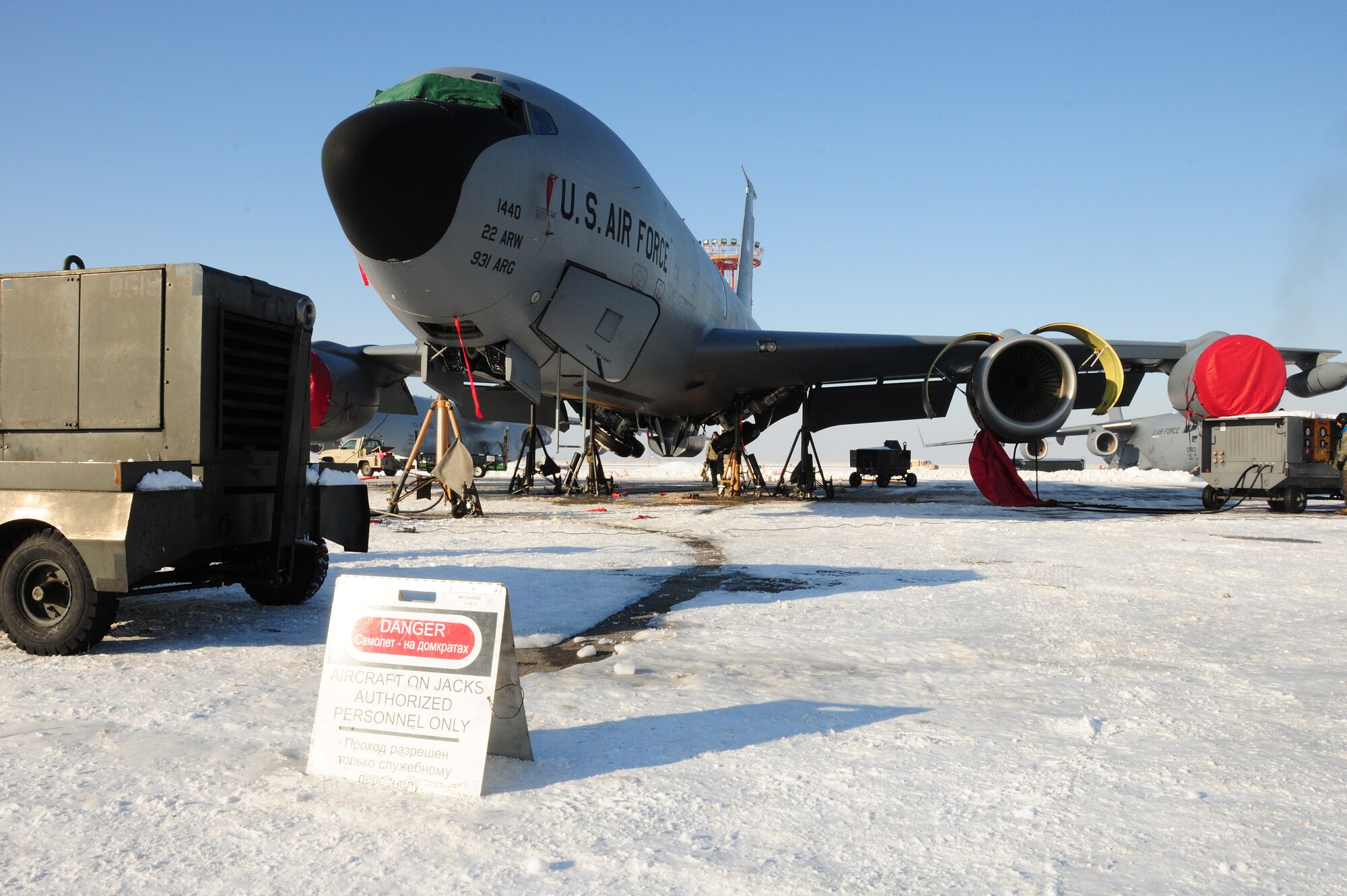 376th Expeditionary Aircraft Maintenance Squadron Airmen jack up a KC-135 Stratotanker on the flightline at the Transit Center at Manas, Kyrgyzstan, Jan. 20, 2010, to test the landing gear hydraulics. In temperatures of -8F and in spite of 10 inches of snow, Airmen here continue to ensure the wing mission gets done. The tankers here deliver hundreds of thousands of pounds of fuel to coalition combat aircraft over Afghanistan. (U.S. Air Force photo/Senior Airman Nichelle Anderson/Released)