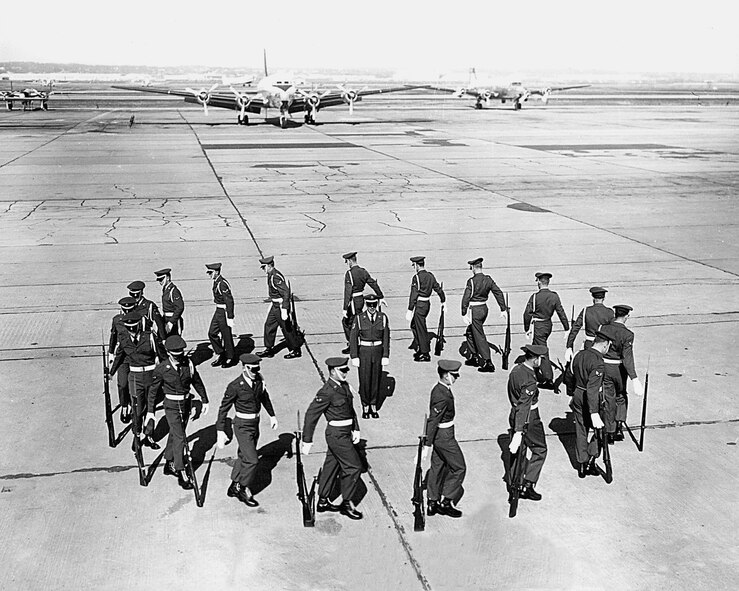 Undated photo of the USAF Honor Guard Drill Team performing drill on a flightline.  Circa 1960s