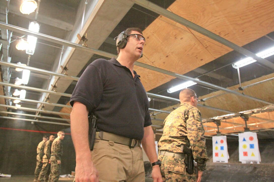 The instructor, Jamison Elder, calls out commands during his Wolf-Tactical Reconnaissance and Personal Protection training at the Indoor Small-Arms Range here Jan 21. Elder, a former recon Marine, designed the pistol training to help service members to be better equipped in today’s combat theaters.