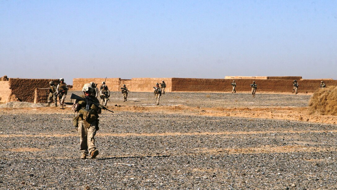Marines with 1st Battalion, 6th Marine Regiment, 2nd Marine Division patrol on foot near villages surrounding Marjah, Afghanistan as part of shaping operations prior to an all out attack on Taliban forces within the city, Jan. 21, 2010. Marines and sailors with 1/6 took part in Operation Moshtarak, the second largest offensive in the history of Operation Enduring Freedom, aimed at wresting the city of Marjah from Taliban control.