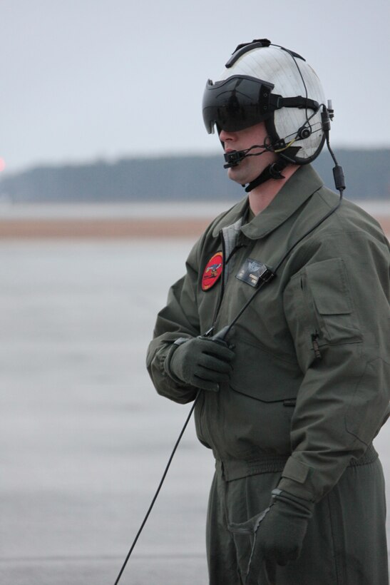 Sgt. William W. Cambron, an HH-46E crew chief with Cherry Point's Marine Transport Squadron 1, mans the air station's flight line.