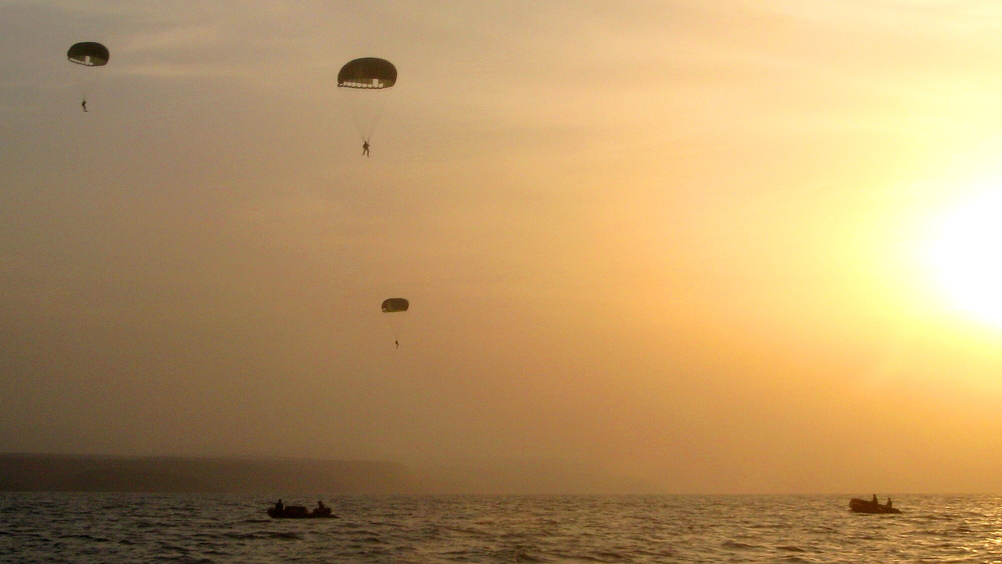 Members of the 31st Rescue Squadron, deployed as the 82nd Expeditionary Rescue Squadron in the Horn of Africa, conduct static line parachute operations over the Gulf of Tadjoura, Djibouti. (Courtesy photo)