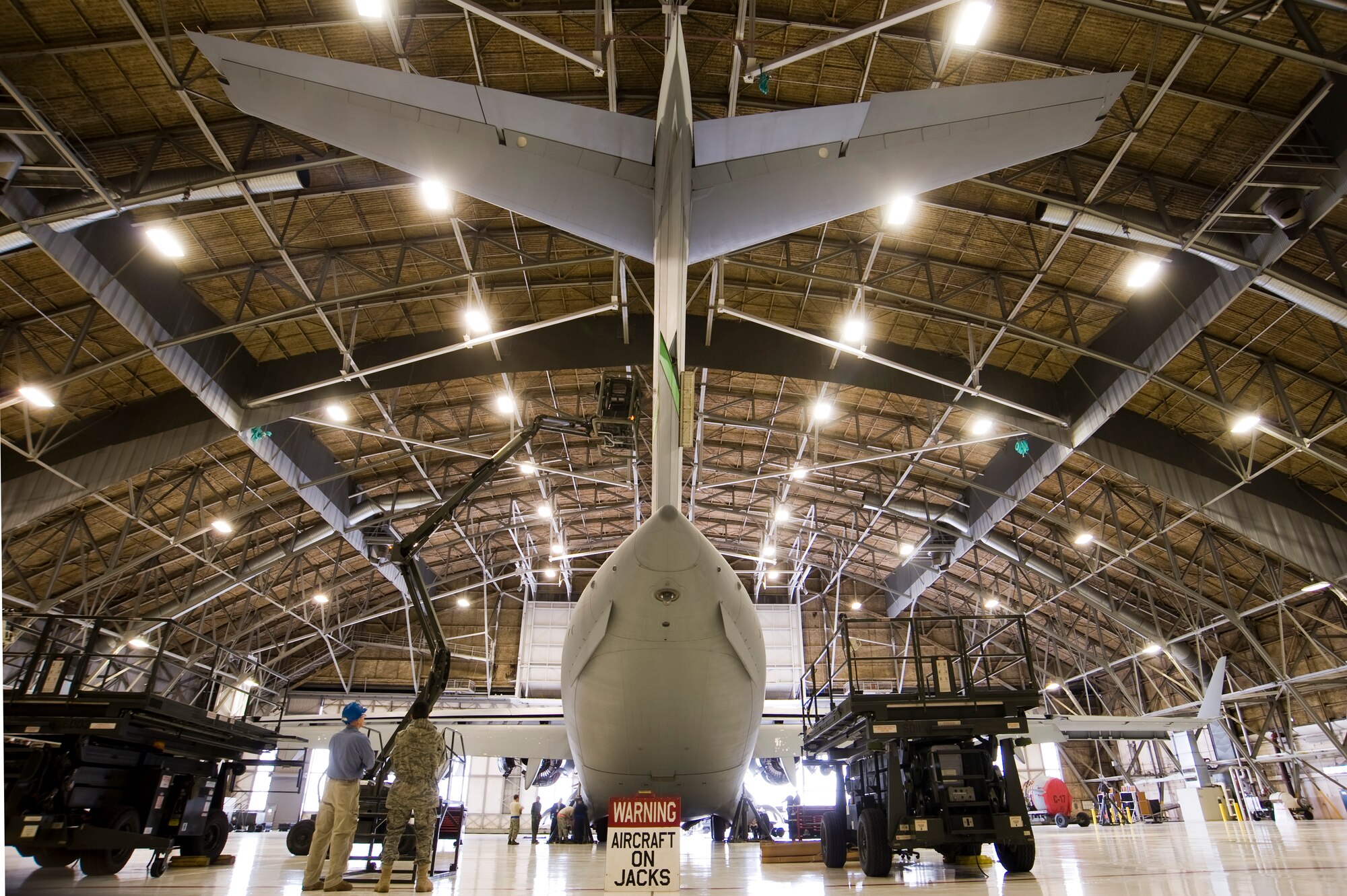 An Airman conducts an inspection of a C-17 Globemaster III during regular maintenance processes in Hangar 2 Jan. 21. Maintenance and logistics Airmen scored a grade of excellent during the Logistics Compliance Assessment Program inspection here Jan. 25 to Feb. 1. (U.S. Air Force photo/Abner Guzman)