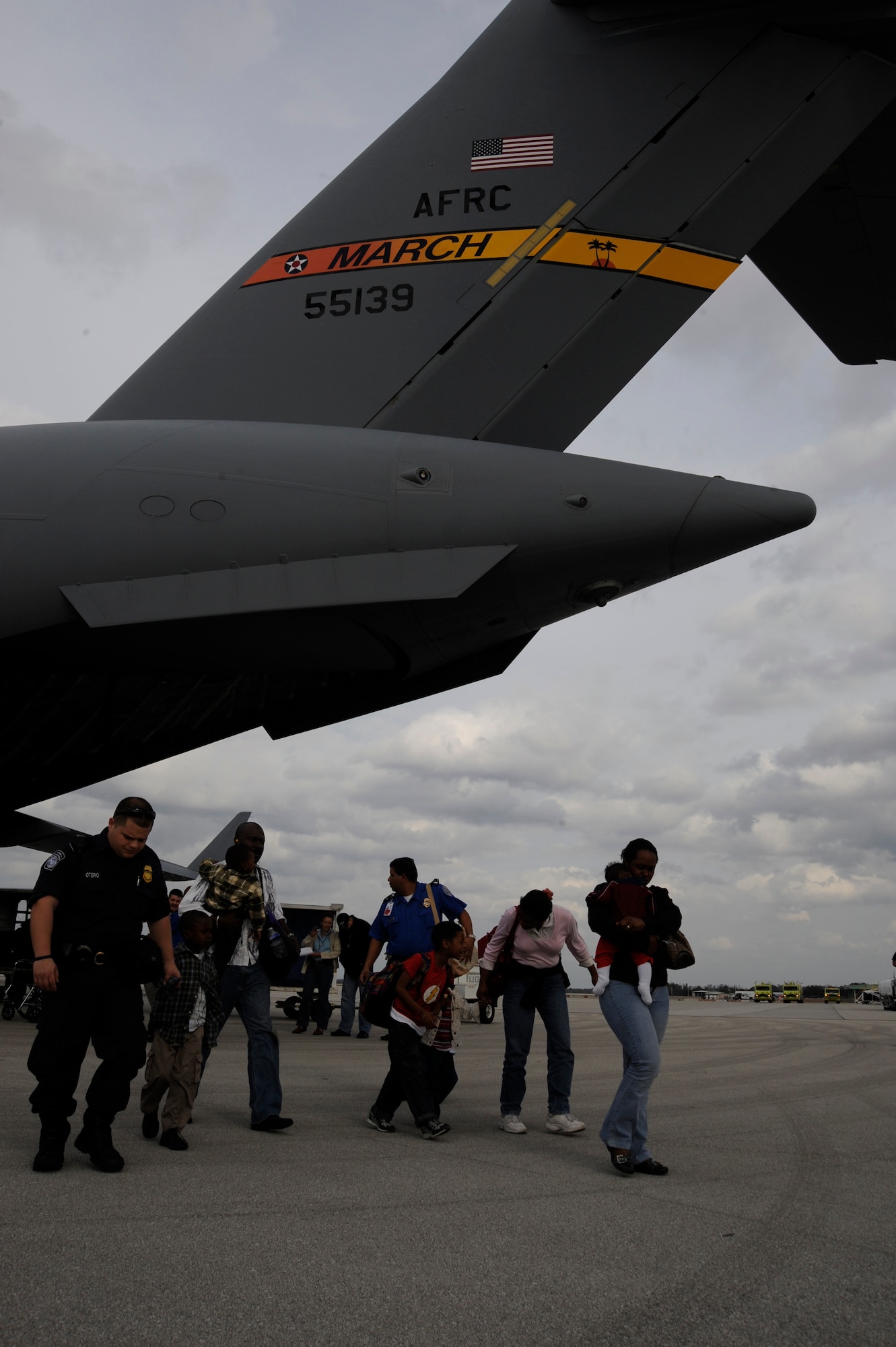Evacuees from last weeks devestating earquake in Haiti exit a C-17 aircraft at Orlando Sanford International Airport Jan. 21, 2010. The C-17 was carrying over 100 evacuees from Haiti; the evacuees consisted of American and Haitian citizens.
(U.S. Air Force photo by Staff Sgt. Joseph L. Swafford Jr./Released)
