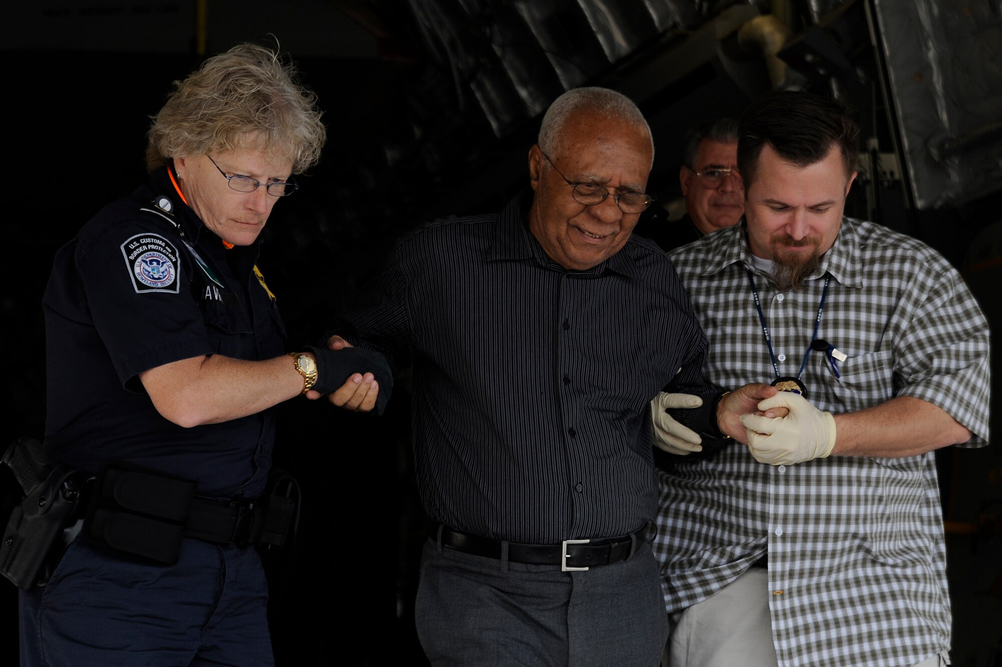 A evacuee from the earthquake that struck Haiti last week is helped off of a C-17 aircraft at Orlando Sanford International Airport Jan. 21, 2010. The C-17 was carrying over over 100 evacuees from Haiti; the evacuees consisted of American and Haitian citizens.
(U.S. Air Force photo by Staff Sgt. Joseph L. Swafford Jr./Released)
