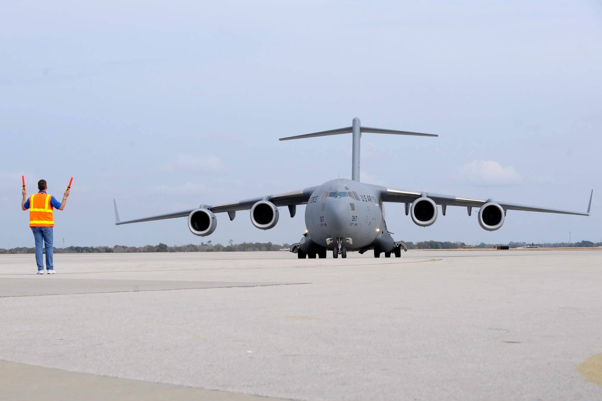 A C-17 from the Mississippi Air National Guard is being directed to park at Orlando Sanford International Airport Jan. 21, 2010. The C-17 was carrying over 100 evacuees from Haiti.
(U.S. Air Force photo by Staff Sgt. Joseph L. Swafford Jr./Released)
