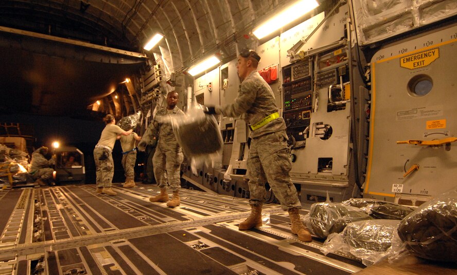 U.S. Air Force service members from the 817th Contingency Response Group, out of McGuire, AFB, New Jersey, load humanitarian supplies Friday, January 15th, 2010, onto a C-17A Globemaster from the 729th Airlift Squadron, out of March, Air Reserve Base, bound for the Port-au-Prince International Airport, Haiti. The C-17 and crew, both out of the 452nd Air Mobility Wing at March Air Reserve Base, are taking part in the massive international effort to assist in rescue, recovery and humanitarian efforts following a 7.0 earthquake. President Barack Obama ordered a swift and aggressive rescue effort.  The January 12, 2010 quake, centered near the island nation's capital of Port-au-Prince, has left untold numbers of residents homeless, injured or dead.(U.S. Air Force photo by Master Sgt. Dawn Price/released)