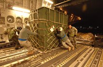 U.S. Air Force service members from the 305th Aerial Port Squadron, out of McGuire, AFB, New Jersey, load humanitarian supplies Friday, January 15th, 2010, onto a C-17A Globemaster from the 729th Airlift Squadron, out of March, Air Reserve Base, bound for the Port-au-Prince International Airport, Haiti. The C-17 and crew, both out of the 452nd Air Mobility Wing at March Air Reserve Base, are taking part in the massive international effort to assist in rescue, recovery and humanitarian efforts following a 7.0 earthquake. President Barack Obama ordered a swift and aggressive rescue effort.  The January 12, 2010 quake, centered near the island nation's capital of Port-au-Prince, has left untold numbers of residents homeless, injured or dead.(U.S. Air Force photo by Master Sgt. Dawn Price/released)