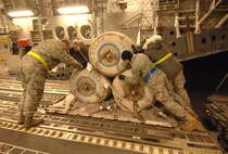 U.S. Air Force service members from the 305th Aerial Port Squadron, out of McGuire, AFB, New Jersey, load humanitarian supplies Friday, January 15th, 2010, onto a C-17A Globemaster from the 729th Airlift Squadron, out of March, Air Reserve Base, bound for the Port-au-Prince International Airport, Haiti. The C-17 and crew, both out of the 452nd Air Mobility Wing at March Air Reserve Base, are taking part in the massive international effort to assist in rescue, recovery and humanitarian efforts following a 7.0 earthquake. President Barack Obama ordered a swift and aggressive rescue effort.  The January 12, 2010 quake, centered near the island nation's capital of Port-au-Prince, has left untold numbers of residents homeless, injured or dead.(U.S. Air Force photo by Master Sgt. Dawn Price/released)