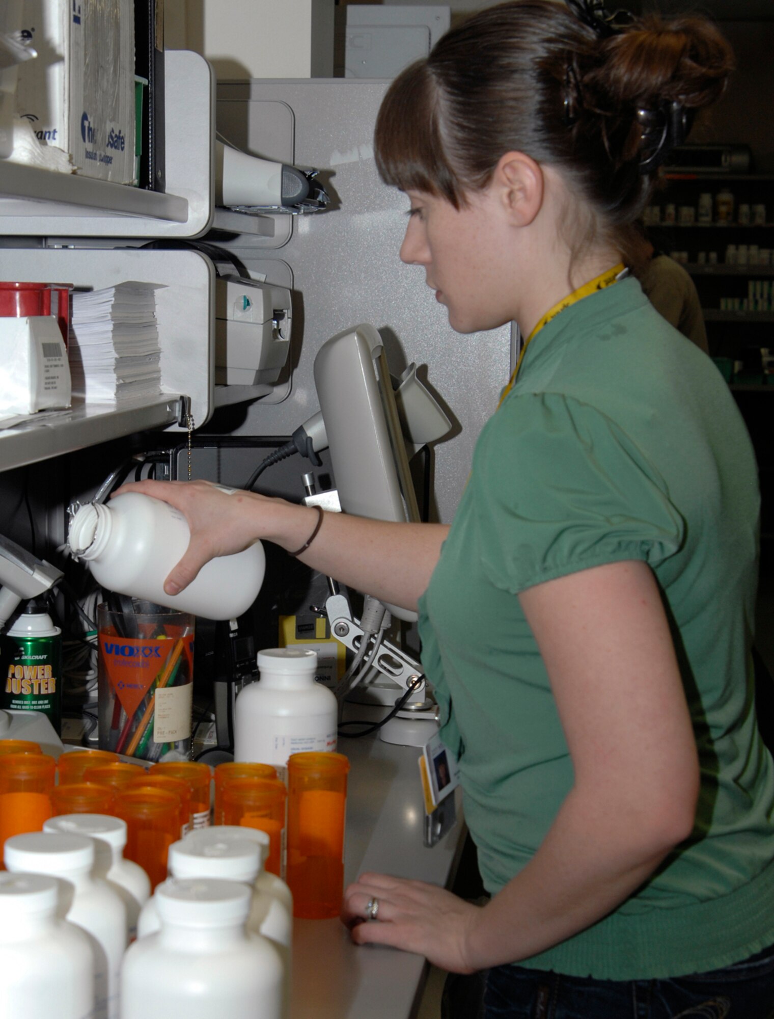 Melinda Hatcher, a 22nd Medical Support Squadron pharmacy technician, weighs and separates medication at the base pharmacy, Jan. 5, 2009, McConnell Air Force Base, Kan. There are three pharmacists, 13 pharmacy technicians and McConnell volunteers who make up the pharmacy staff here. (U.S. Air Force Photo/Airman 1st Class Justin Shelton)