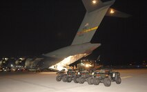 A C-17A Globemaster crew from the 729th Airlift Squadron, out of March, Air Reserve Base., load supplies and equipment Friday, January 15th, 2010, bound for the Port-au-Prince International Airport, Haiti.  The C-17 and crew, both out of the 452nd Air Mobility Wing at March Air Reserve Base, are taking part in the massive international effort to assist in rescue, recover and humanitarian efforts following a 7.0 earthquake. President Barack Obama ordered a swift and aggressive rescue effort.  The January 12, 2010 quake, centered near the island nation's capital of Port-au-Prince, has left untold numbers of residents homeless, injured or dead.(U.S. Air Force photo by Master Sgt. Dawn Price/released)
