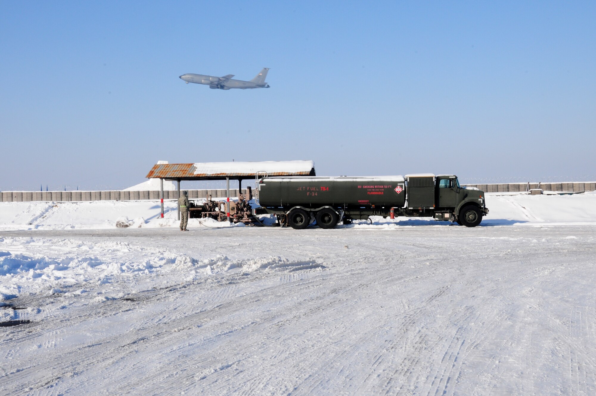 A KC-135 Stratotanker takes off Jan. 19, 2010, at the Transit Center at Manas Air Base, Kyrgyzstan. The 376th Expeditionary Logistics Readiness Squadron petroleum, oil and lubricants flight here was the first in the area of responsibility to implement a new pre-filter system for fuel which will save time and money and deliver better, cleaner fuel to the aircraft the KC-135 refuels. (U.S. Air Force photo/Senior Airman Nichelle Anderson)