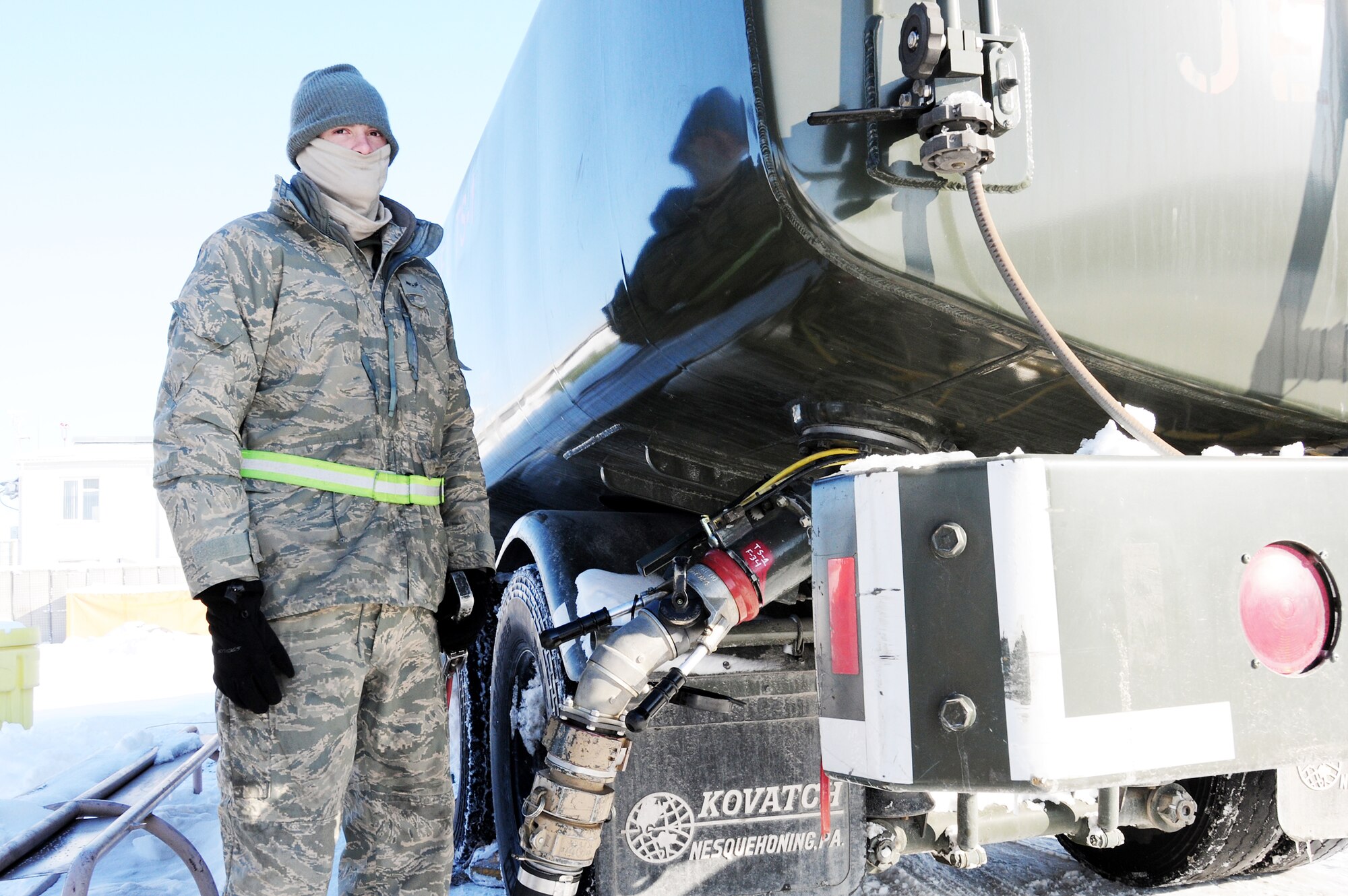 Airman 1st Class Justin Bell, pumps jet fuel into a tank to be transported to the flightline at the Transit Center at Manas, Kyrgyzstan, Jan. 19, 2010. Airman Bell is a 376th Expeditionary Logistics Readiness Squadron petroleum, oil and lubricants specialist. The POL flight here was the first in the AOR to implement a new pre-Airman 1st Class Justin Bell pumps jet fuel into a tank to be transported to the flightline Jan. 19, 2010, at the Transit Center at Manas Air Base, Kyrgyzstan. Airman Bell is a 376th Expeditionary Logistics Readiness Squadron petroleum, oil and lubricants specialist. (U.S. Air Force photo/Senior Airman Nichelle Anderson) 