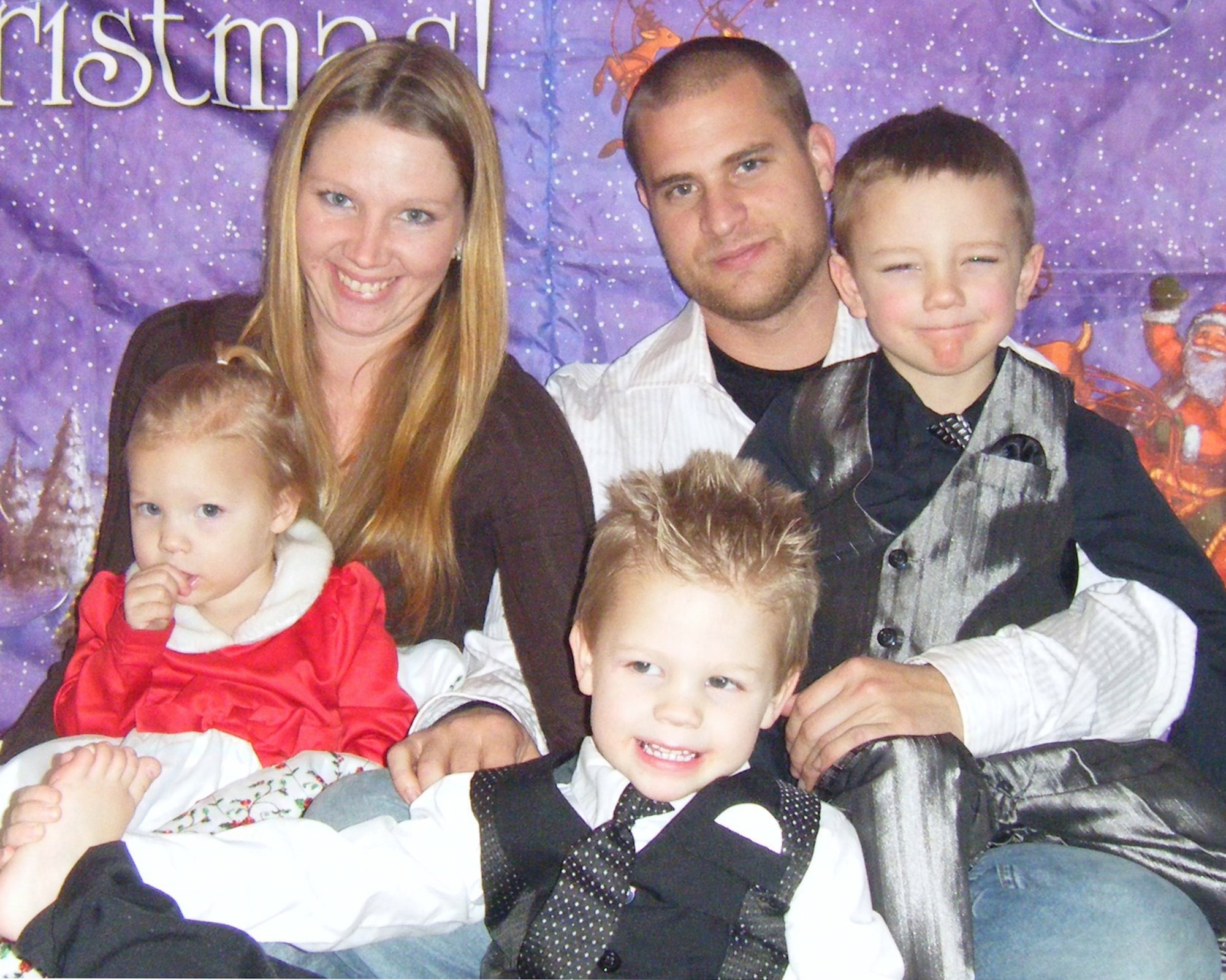 Staff Sgt. Justin Hebert, 22nd Aircraft Maintenance Squadron crew chief, his wife, Rebecca, and their children, from left to right, Alexis, 2, Liam, 3 and Zane, 5, have earned the McConnell Year of the Air Force Family Spotlight award.