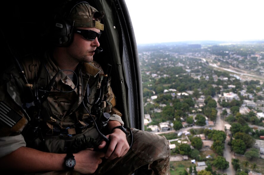 A U.S. Air Force combat controller from the 21st Special Tactics Squadron, Pope Air Force Base, N.C., assesses a potential relief supply air delivery drop zone during Operation Unified Response in Port-au-Prince, Haiti, Jan. 19, 2010. The U.S. Department of Defense contingent is part of a larger national and international relief effort led by the U.S. Agency for International Development in response to the 7.0 earthquake that struck Haiti Jan. 12, 2010. (U.S. Air Force photo by Tech. Sgt. Dennis J. Henry Jr./Released)