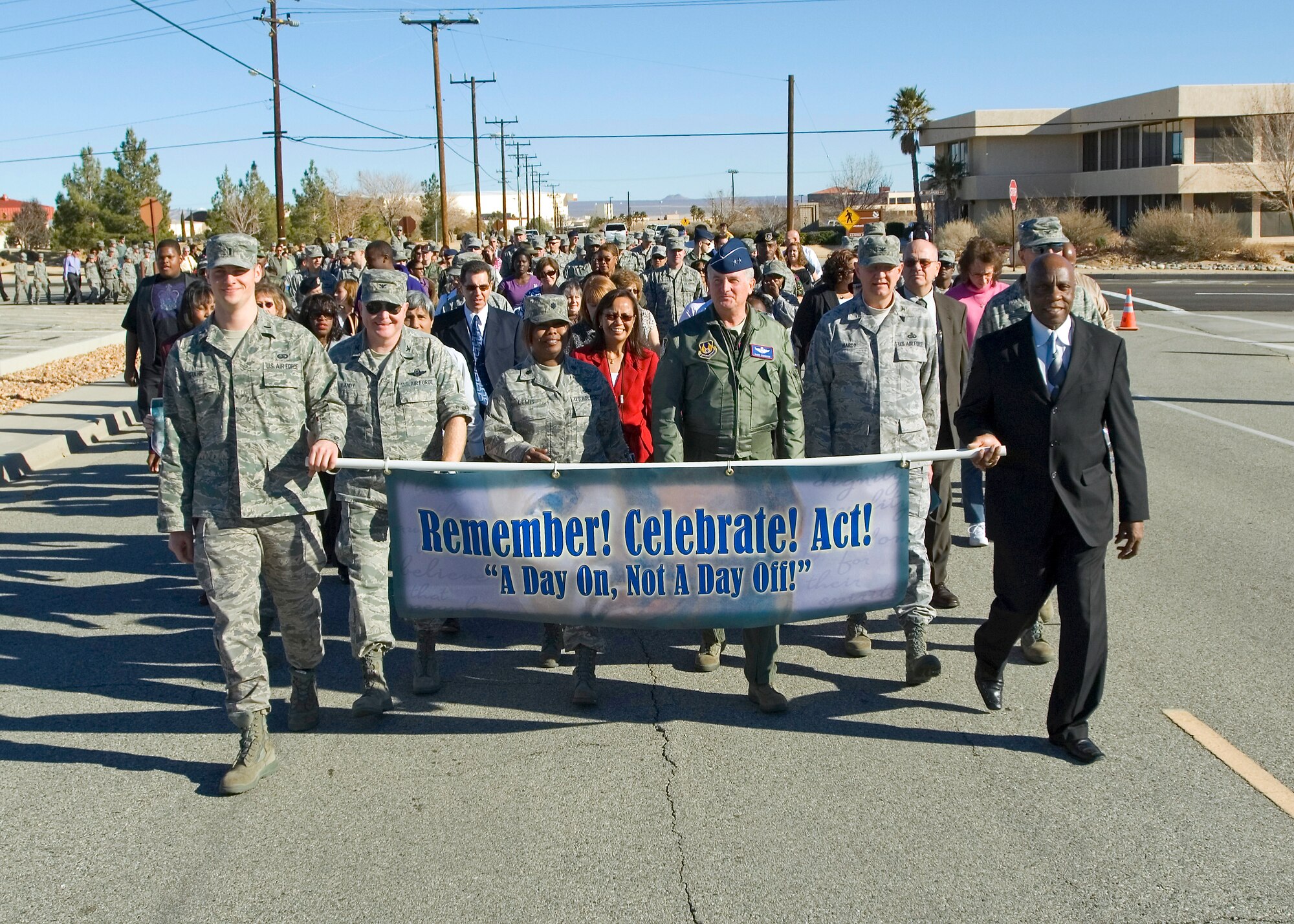 Maj. Gen. David Eichhorn(right), Air Force Flight Test Center commander, along with Lt. Col. Susie Lewis, 95th Force Support Squadron commander and Col. Jerry Gandy(left), 95th Air Base Wing commander, lead more that 250 Edwards Airmen in a march from 95th Air Base Wing Headquarters to chapel 1 Dec. 14. (Air Force photo/Heather Anhalt)

