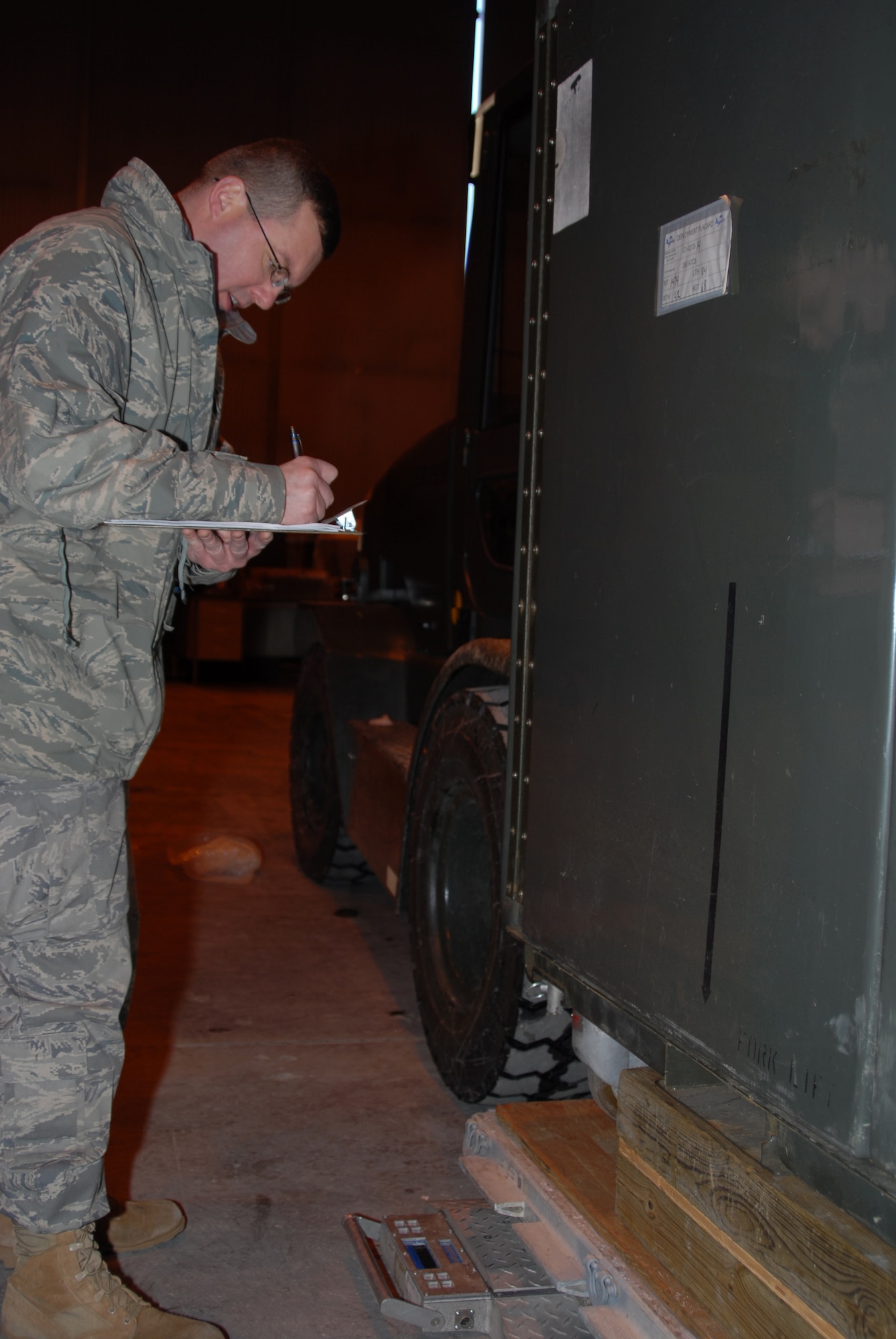 Senior Master Sergeant Darrell Whitney of the 260th Air Traffic Control Squadron records weights of cargo to be airlifted to Haiti.  The cargo is being prepared for deployment to Haiti along with the unit’s mobile control tower and about 12 personnel in support of relief efforts after the recent earthquake.  