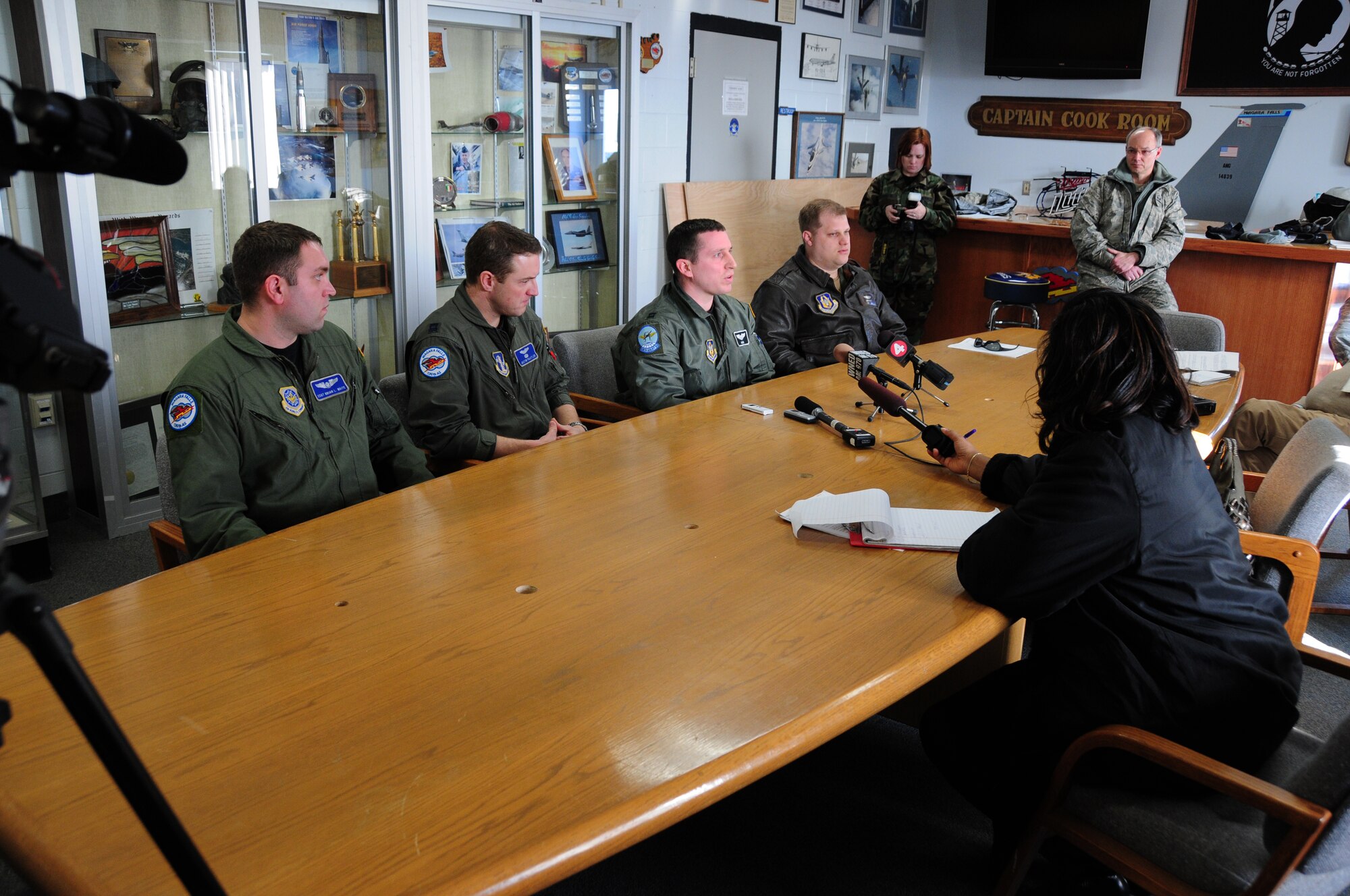 NIAGARA FALLS AIR RESERVE STATION, NIAGARA FALLS, NY-- Returning members of the 914th and 107th Airlift Wings who have been flying relief missions to and from Haiti are interviewed by local media upon arrival, January 21. (U.S. Air Force photo by Staff Sgt Stephanie Clark)