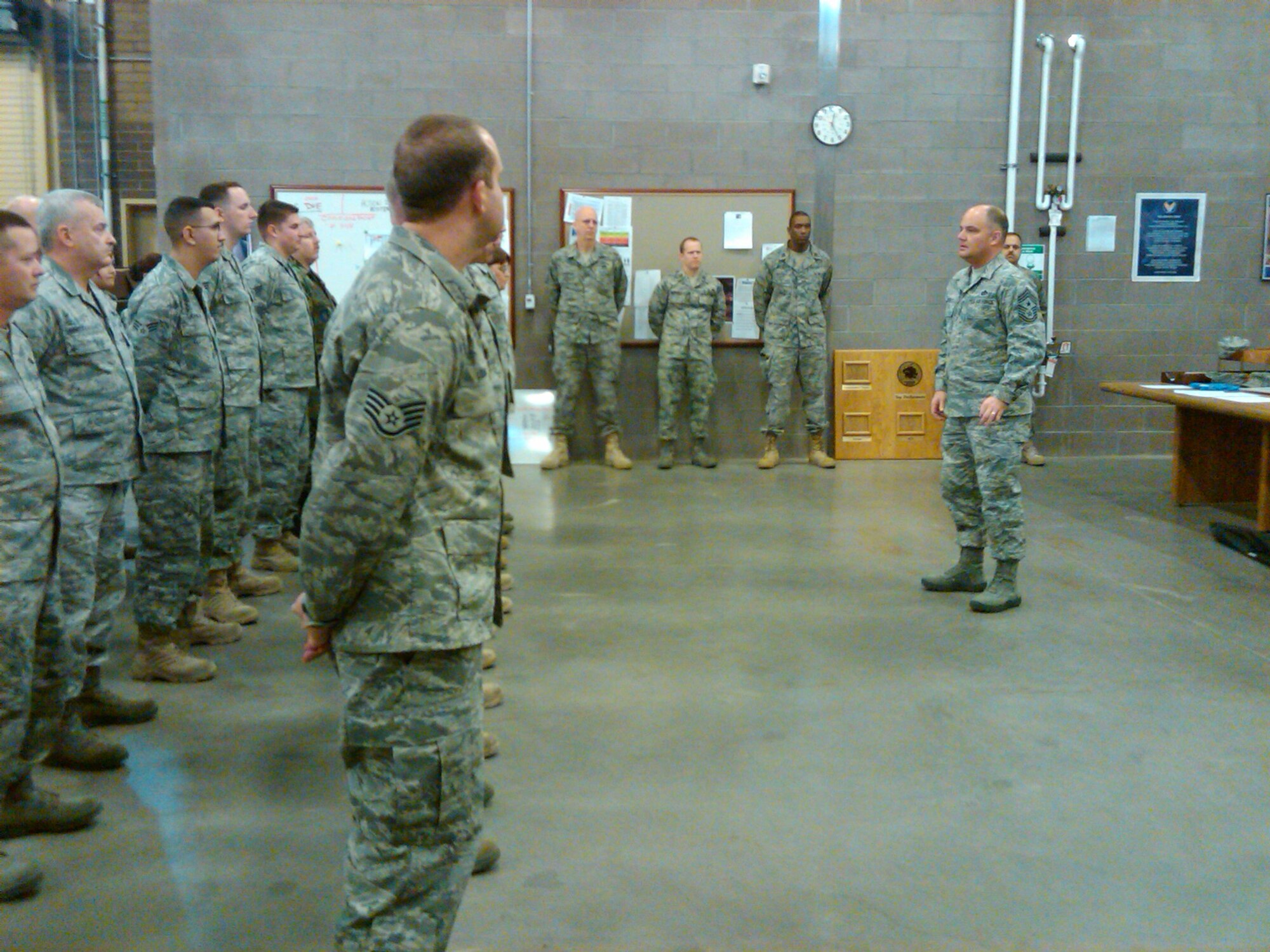Chief Master Sgt. Dwight D. Badgett, Air Force Reserve Command command chief, talks with Airmen of the 944th Civil Engineer Squadron during a visit to Luke Air Force Base, Ariz.