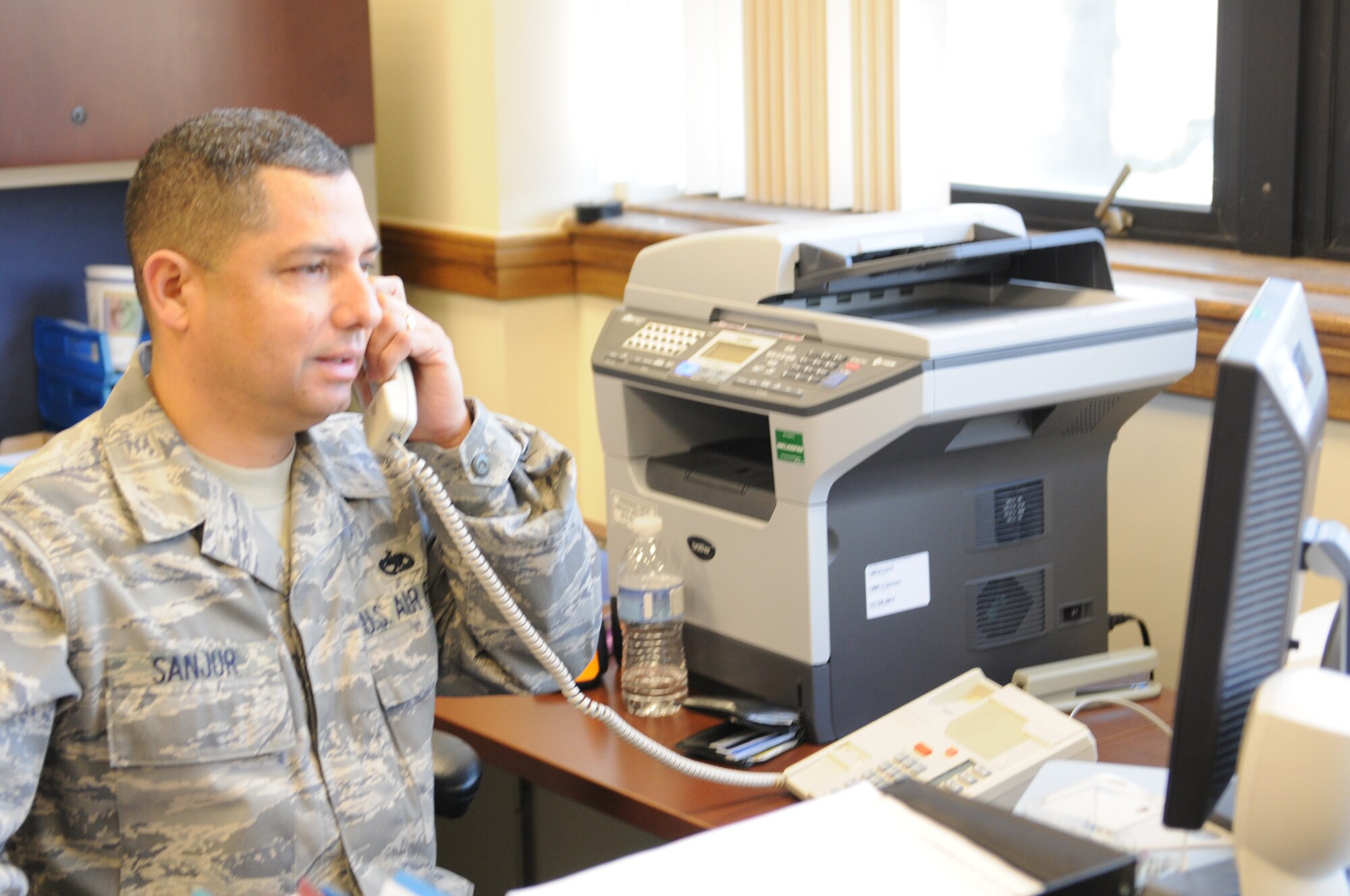 TSgt. Rolando E. Sanjur, 69th Aerial Port Squadron, assists in the 459th Air Refeling Wing Military Pay Office, travel claims section.  Wing leadership has instituted a series of changes to improve customer service and claims procedures in the Military Pay Office. (U.S. Air Force Reserve photo by Capt. Rebecca A. Garcia)