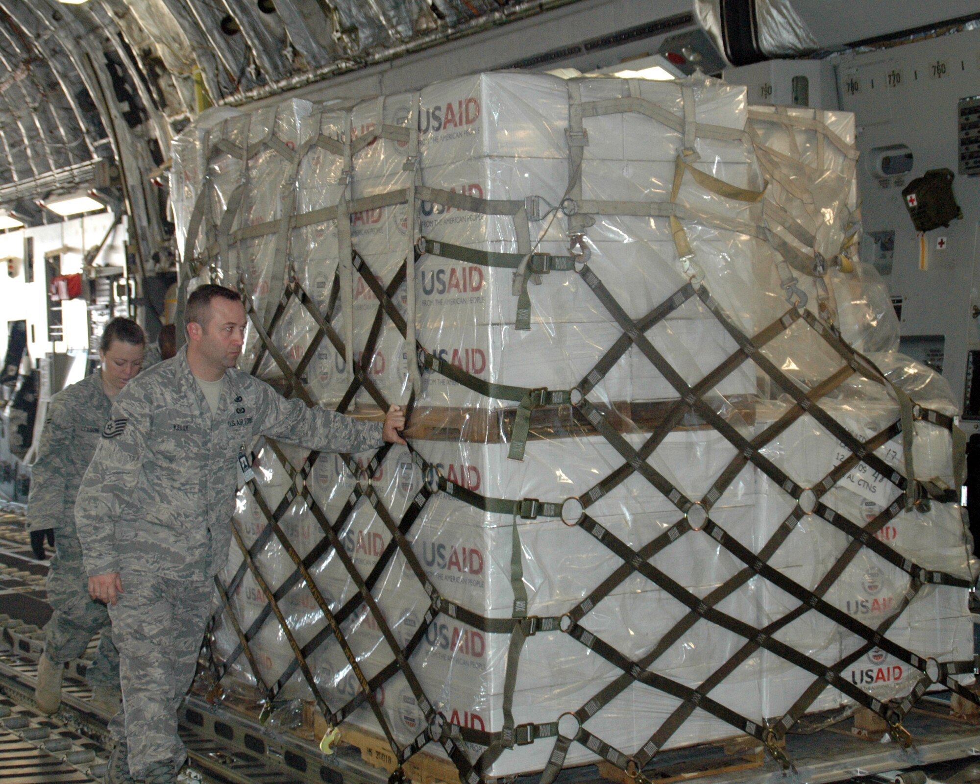 Members of Team Chaleston load pallets of humanitarian relief supplies onto a C-17 bound for Port-au-Prince, Haiti on January 17, 2010. Team Charleston has flown humanitarian missions to Haiti around the clock since the relief effort began. (U.S. Air Force photo by Mandy Gaither)  