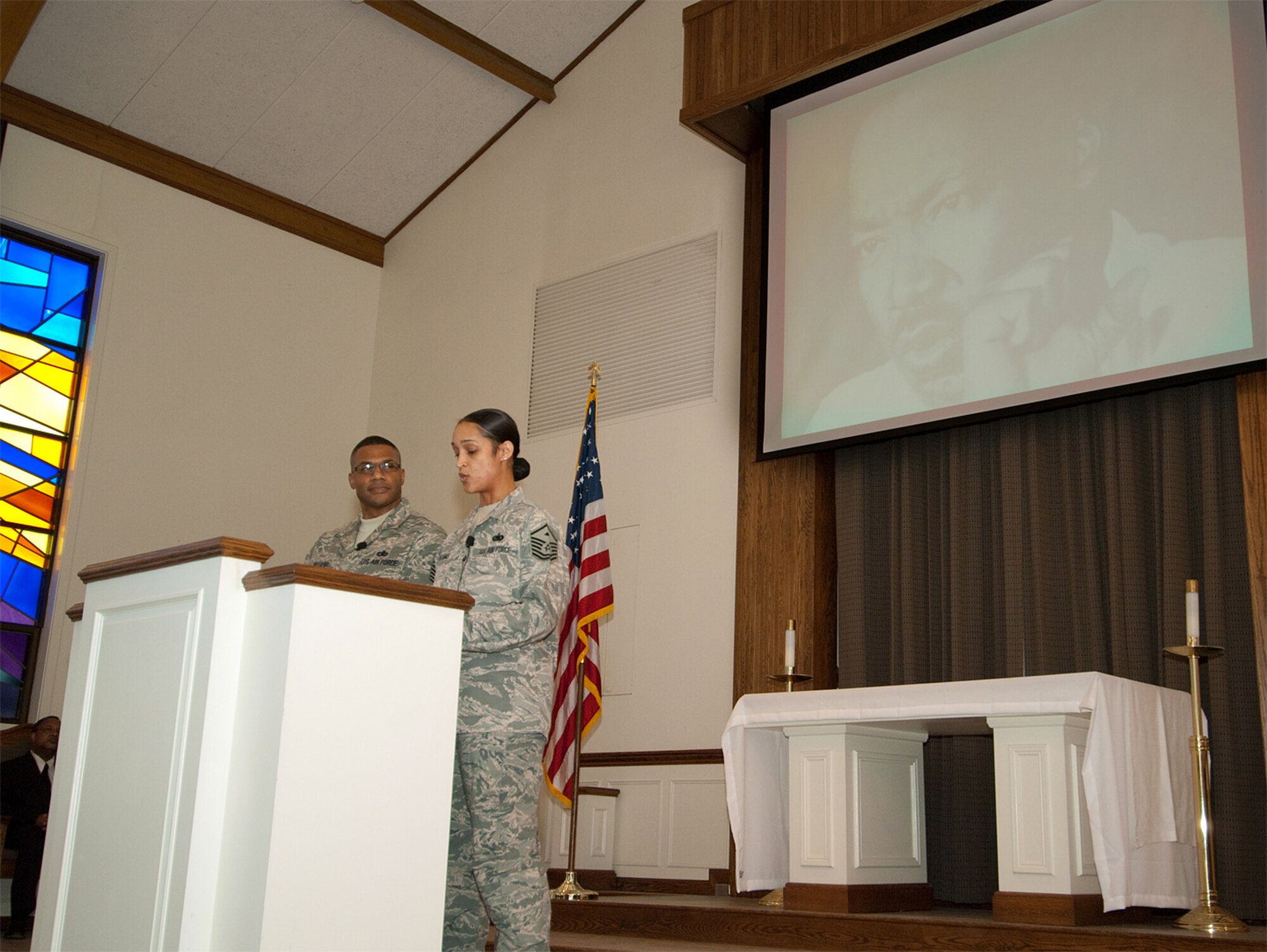 HANSCOM AIR FORCE BASE, Mass. -- Chief Master Sgt. Kenneth Williams, Electronic Systems Center and 66th Air Base Wing command chief, and Master Sgt. Jamie Williams, 66th Medical Group first sergeant, speak at Hanscom's Dr. Martin Luther King Jr. Commemorative Service, held Jan. 15 at the Base Chapel.  

During his speech, Chief Williams echoed the desire for increased unity and understanding among all Americans that Dr. King expressed in his "I Have a Dream" speech.  

"Keeping the spirit moving will redefine how Americans define 'we.' We must work diligently to instill the spirit of achievement, forgiveness and togetherness in our children," the chief said. "Let us join together to continue the hard but critical work of reconciliation and justice to build a multicultural America in which our notions of community and the people called 'we' expands to include everyone."  (U.S. Air Force photo by Rick Berry)
