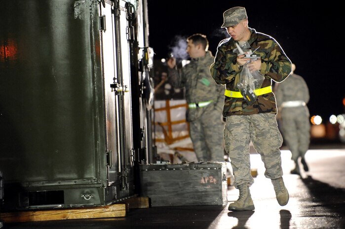 NELLIS AIR FORCE BASE, Nev.-- Senior Airman Kevin Bittner a 99th Logistics Squadron cargo build up augmenttee from the 99th Communications Squadron attaches a Radio Frequency Identification Tag to a pallet in the cargo deployment function yard on Nellis Air Force Base as part of a 99th Air Base Wing operational readiness exercise Jan. 19. The ORE is in preparation for an upcoming operation readiness inspection Jan. 25-29. 
(U.S. Air Force photo by Tech. Sgt. Michael R. Holzworth)