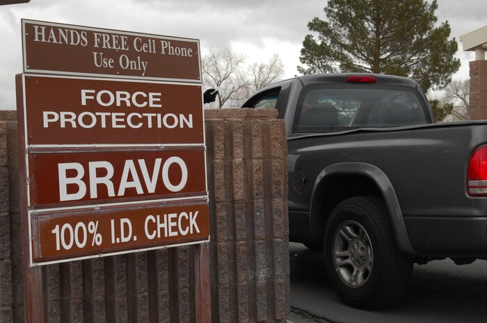 NELLIS AIR FORCE BASE, Nev.-- A vehicle passes by an updated force protection sign while entering Nellis Air Force Base during Operational Readiness Exercise Cornet White 09-ACC-15 Jan. 19. (U.S Air Force photo/ Staff Sgt. Taylor Worley)