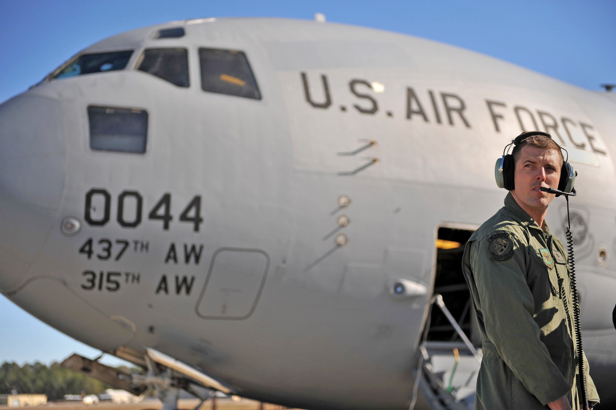 Tech. Sgt. Chad Buttler conducts a preflight check on a C-17 Globemaster III Jan. 18, 2010, at Pope Air Force Base, N.C., before taking off for a humanitarian mission to Haiti. The C-17 and crew conducted the first humanitarian air delivery mission over Haiti to test the feasibility of future missions in speeding along the flow of supplies into the country. Sergeant Butler is a flying crew chief from the 437th Aircraft Maintenance Squadron at Charleston Air Force Base, S.C. (U.S. Air Force photo/Master Sgt. Shane A. Cuomo)