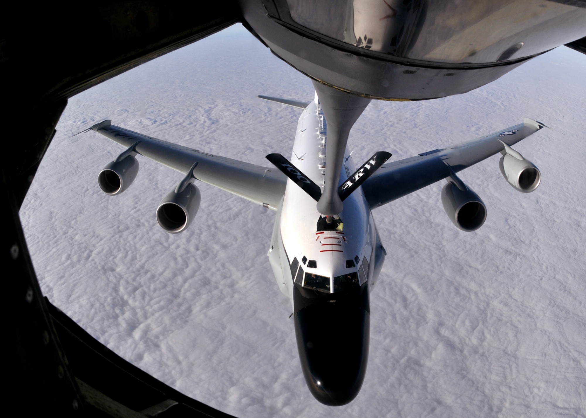 RAF MILDENHALL, England -- An RC-135 Rivet Joint, launched from RAF Mildenhall, takes fuel from a 100th Air Refueling Wing KC-135 in the skies over England Jan. 21.  The aircraft, assigned to the 55th Wing, Offutt Air Force Base, Neb., carries members of the 488th Intelligence Squadron and 95th Reconnaissance Squadron, both based at RAF Mildenhall.  (U.S. Air Force photo by Staff Sgt. Austin M. May)