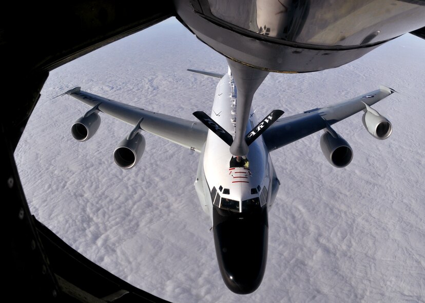 RAF MILDENHALL, England -- An RC-135 Rivet Joint, launched from RAF Mildenhall, takes fuel from a 100th Air Refueling Wing KC-135 in the skies over England. Since 2002, the men and women of RAF Mildenhall continued to support the response of Sept. 11, 2001. Over the past year, the Air Force flew more than 555,000 hours supporting of operations in Afghanistan and Iraq, which equates to about 530 sorties per day. (U.S. Air Force photo by Staff Sgt. Austin M. May)