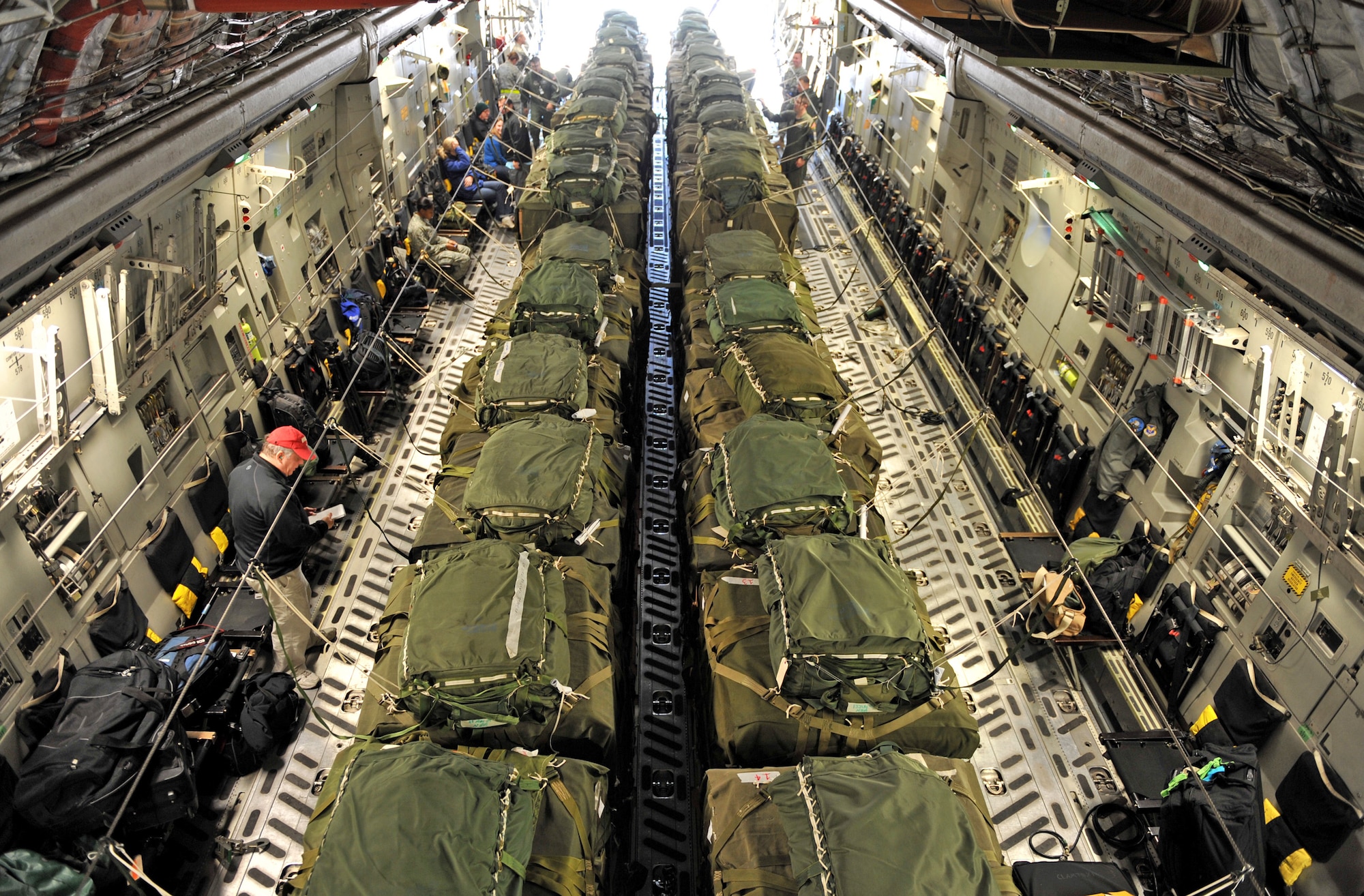 A C-17 Globemaster III cargo aircraft is loaded with 40 pallets of relief supplies Jan. 18, 2010, at Pope Air Force Base, N.C., before taking off for a humanitarian mission to Haiti. The C-17, from Charleston Air Force Base, S.C., conducted the first humanitarian air delivery mission over Haiti. U.S. Southern Command is deploying assets to Haiti to conduct search and rescue operations, damage assessments and sustained humanitarian assistance and disaster relief operations. (U.S. Air Force photo/Master Sgt. Shane A. Cuomo)