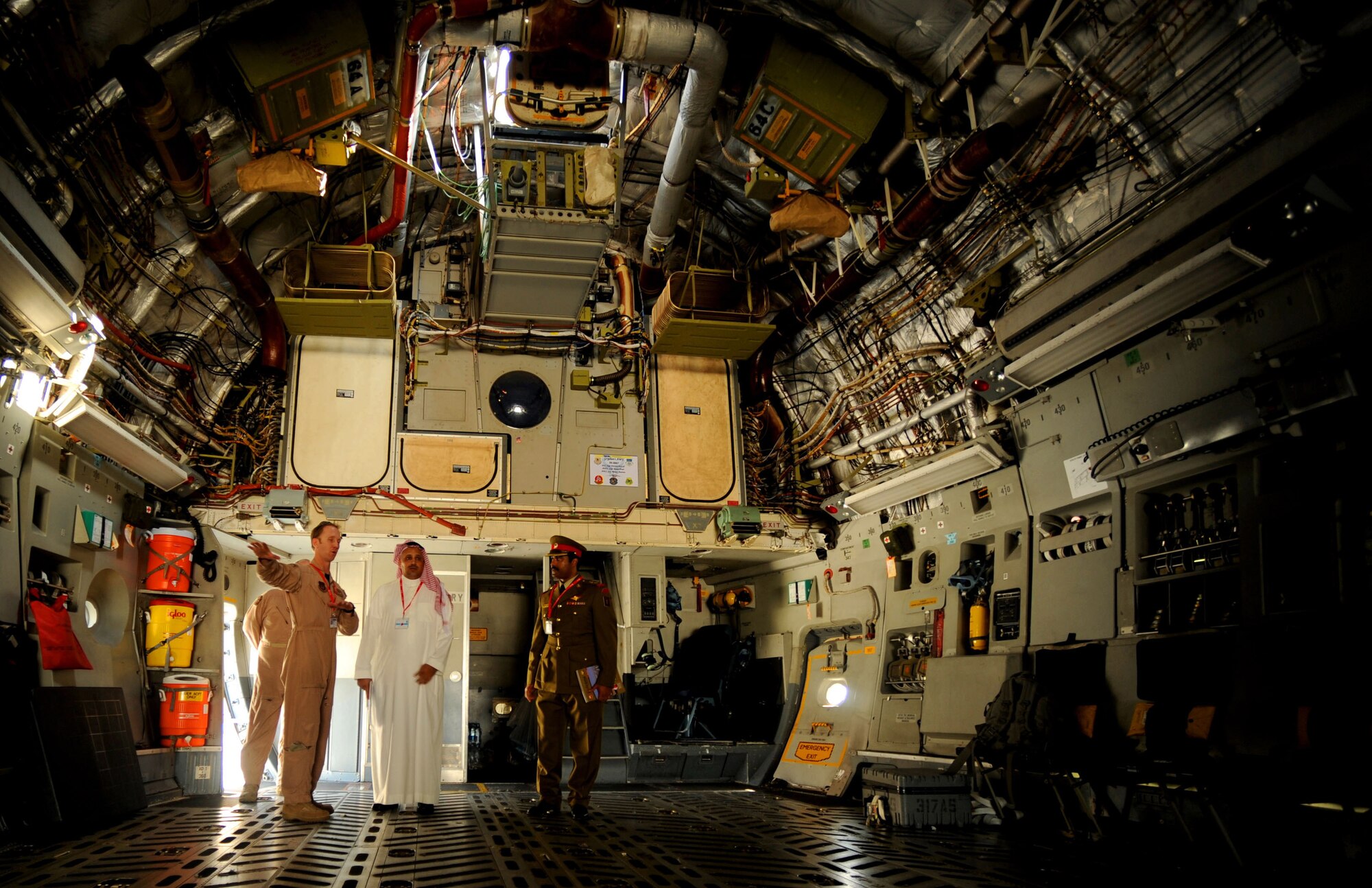 U.S. Air Force Maj. Edward Taillon, 317th Airlift Squadron C-17 Globemaster III pilot , explains the capabilities of the transport aircraft to members of the Saudi Arabian Air Force during the Bahrain Internatioanl Airshow, Jan. 21, 2010.   (U.S. Air Force photo/ Staff Sgt. Angelita Lawrence/released)