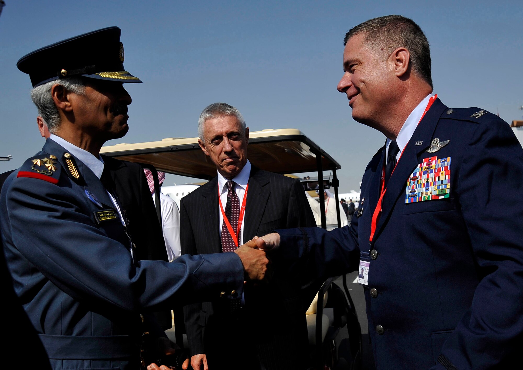 U.S. Air Force Col. Michael Cosby, Kuwait Air Force Operational Advisor, shakes hands with a member of the Bahraini Air Force during the Bahrain International Airshow Jan. 21, 2010. (U.S. Air Force photo/ Staff Sgt. Angelita Lawrence/released)