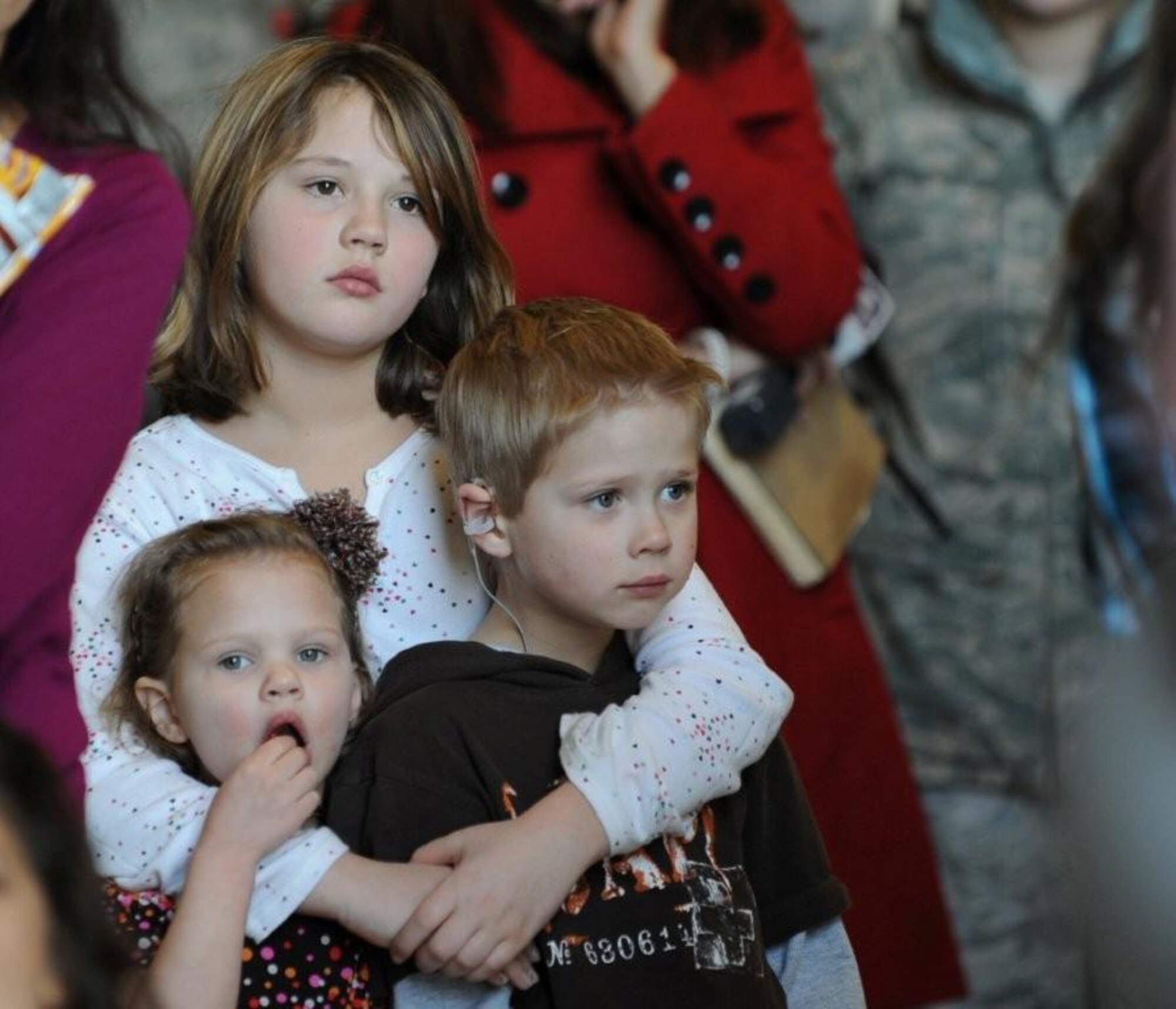 MOUNTAIN HOME AIR FORCE BASE, Idaho -- Hailey, Trevor, and Laneybelle, wait for their father Tech. Sgt Steven Russell, 726th Air Control Squadron, to return home Jan. 19. More than 100 members of the 726th ACS return from their deployments in support of U.S Central Command in Afghanistan and Southwest Asia. (U.S. Air Force photo by Airman 1st Class Renishia Richardson)